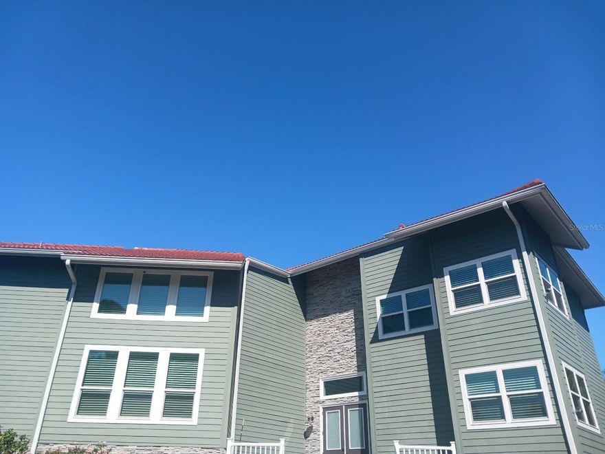 Nestled on a secluded one-acre lot, this coastal-inspired home offers a blend of luxury, privacy, and unobstructed views on the widest part of the peaceful Heron Lagoon. This estate is a true waterfront paradise and was completely renovated in 2019. The home features an open-concept floor plan with architectural details and custom finishes throughout. The living room is filled with natural light through a wall of sliders that access the outdoor pool, spa, and patio. The kitchen is incredible, with ample cabinetry, a custom-designed island with a granite countertop, stainless steel appliances, and is conveniently located between the formal dining room and living room. The adjoining breakfast nook offers stunning views and features a two-story quarried stone wall and large custom windows. The second floor is home to the spacious primary bedroom suite, which includes a 30-foot custom built-in window box, two sitting areas, and a luxurious bath with a soaking tub, dual pedestal sinks, and a walk-in closet. The office and gym can easily be converted into two additional bedrooms if desired. Outside, the property features an expansive waterfront pool and spa surrounded by a paver pool deck, a covered poolside area for watching sunsets or dining al fresco, and large front, side, and rear yards. The backyard also offers access to the water, perfect for fishing, kayaking, paddleboarding, and swimming. Additional features of this exceptional property include a circular driveway with mature pine trees, a second-floor balcony with Trex composite decking, and a lower level with storage, a separate entrance, and a garage that can accommodate four cars. Extensive renovations completed in 2019 include a 50-year tile roof, PGT custom hurricane-impact windows and doors, four state-of-the-art Lenox HVAC units, and much more. The property is also zoned for a second home/guest house, and a dock was previously permitted. With its prime location on Siesta Key, this estate offers the perfect blend of luxury living and waterfront paradise. Just a short walk from your front door, you will find your private marina and the sands of Turtle Beach, while the world-famous Siesta Key Beach and Siesta Village are just a short distance away.