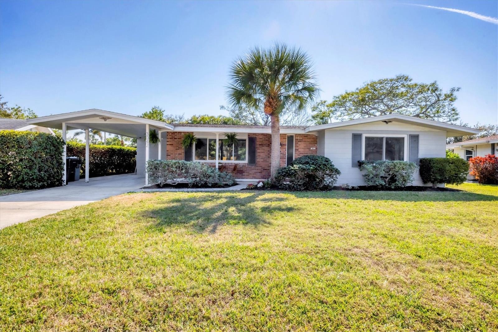 Charming Gulf Gate Gem! Move-In Ready, Renovated 2-Bedroom, 2-Bathroom home plus 37 x 16 bonus flex space in the highly sought-after Gulf Gate neighborhood – Only Minutes from the World-Famous #1 Beach in America, Siesta Key!
Welcome to this meticulously maintained, renovated single-family home located on a quiet street in the heart of Gulf Gate. This one-story oasis offers 2 bedrooms, 2 full bathrooms, and a fully updated kitchen featuring stainless-steel appliances, modern countertops, and stylish fixtures. The laundry room and pantry are located right off the kitchen, adding extra convenience to everyday living.
The bright and airy family room, with a built-in electric fireplace, is the perfect place to relax and entertain. A cozy space off the kitchen offers an area ideal for relaxing after a glorious day at the beach. The large second living space in the rear of the home offers versatility, whether you envision it as a dining area, office, or additional living space. Large plank, wood-inspired tile floors flow throughout the entire home creating a cohesive and inviting environment. Crown molding adds a lovely touch of sophistication.
Step outside to a massive patio with elegant pavers, seamlessly connected to a beautifully landscaped yard. This outdoor area is ready for your personal touch—whether you envision a pool, lanai, or expanded outdoor living space.
The absolute coolest feature of this home is the MASSIVE, FULLY PERMITTED flex space in the rear of the home! The 37 x 16 attached space is drywalled and equipped with A/C & electrical. The possibilities for this room are endless—perfect for a home gym, workshop, studio, home office, pool house or guest suite. It won’t take much to finish off the space! Gulf Gate is known for its large, flat lots, giving owners ample room to grow, with potential for future home additions and amazing outdoor spaces.
Convenience is key with this property’s central location. Endless shopping options, including Publix, Costco, highly rated local restaurants, and more are just minutes away. Whether you’re heading out for a day on Siesta Key’s powdered sugar sands, exploring downtown Sarasota, St. Armands Circle, and beyond, every destination is extremely convenient. The shops and restaurants in Gulf Gate are a quick walk or bike ride from your front door!
This home has been beautifully cared for and offers a rare opportunity to own a renovated gem in one of Sarasota’s most desirable neighborhoods. If you are looking for an investment property, this home offers tremendous opportunities for rental income. The roof was replaced, and the interior re-piped in 2009. An ADT alarm system and several newer hurricane windows give you peace of mind. Buyers, this is a great time to make a purchase in a highly desirable area of Sarasota!