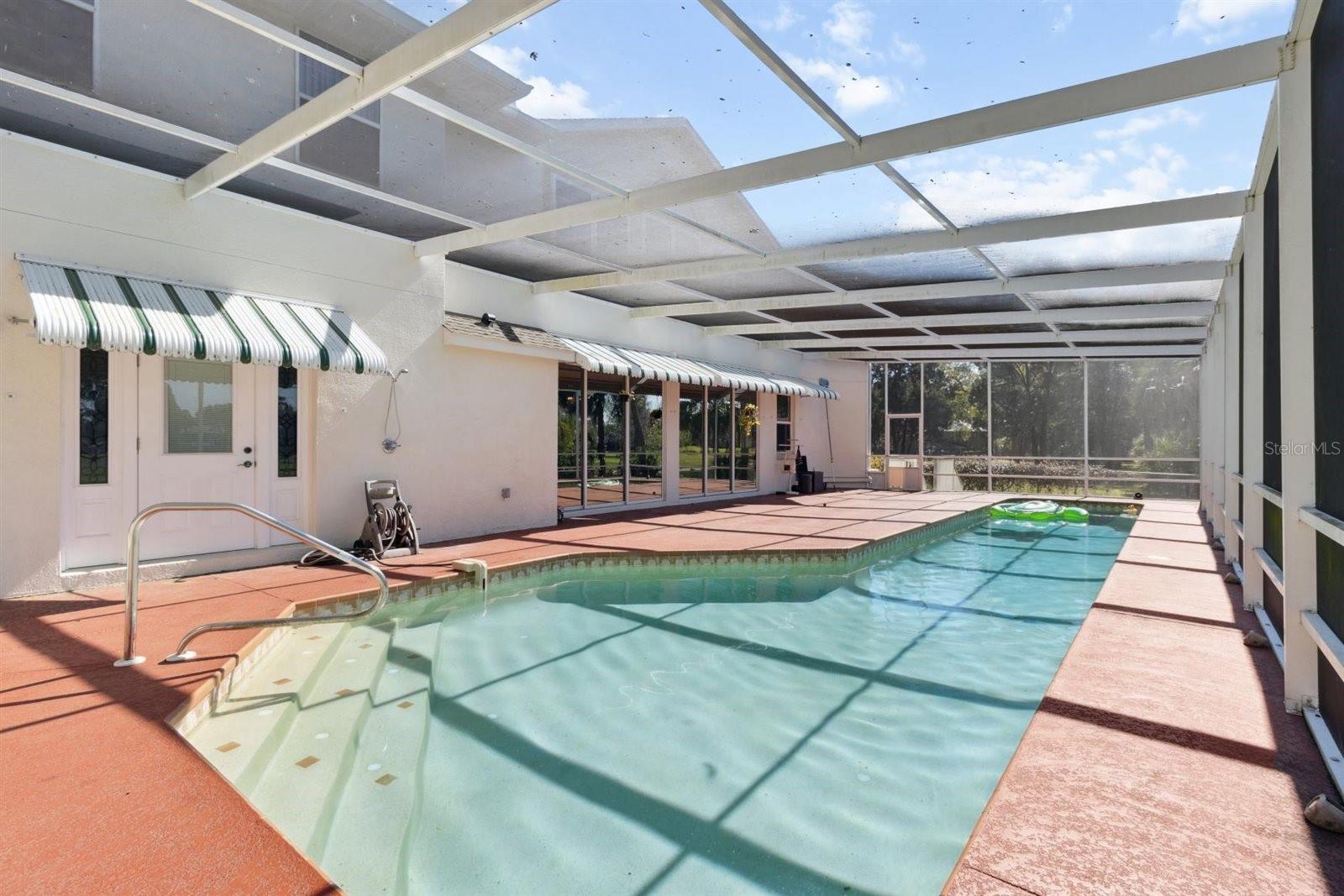 Motivated seller! We have reduced the price in accordance with market changes. Please make an offer! Take a look at this beautifully crafted custom concrete block home in Crystal River, offering 4,148 square feet of thoughtfully designed living space. This spacious two-story residence features three bedrooms and two full baths in the main home, along with a separate two-bedroom, one-bath in-law suite with its own private entrance—perfect for multi-generational living or guest accommodations. Built with a raised stem wall and slab foundation, the home combines durability with elegant design.
Enjoy serene views of the golf course and pond from your large backyard pool, creating a peaceful and private outdoor retreat ideal for entertaining or relaxing. The golf course has been recently sold, and is undergoing redesign. Purchase now before the newly designed gold course sends the prices higher! The home’s interior offers both formal and casual living spaces, a convenient powder room, and designer finishes throughout. The roof was replaced in 2022, and the HVAC system was updated in 2016, providing added value and peace of mind.
Located just minutes from Kings Bay and Fort Island Beach, this home offers easy access to boating, fishing, and Crystal River’s renowned coastal lifestyle. Experience a well-built, spacious home in a prime location—schedule your showing today.