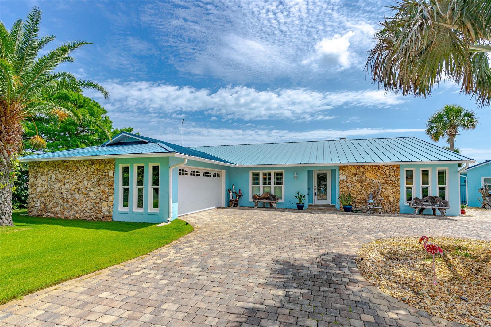 DIRECT RIVERFRONT FAMILY COMPOUND. THIS ONE-OF-A-KIND CUSTOM-BUILT HOME IS UNBELIEVABLE. ONE OF THE LARGEST RIVERFRONT PROPERTIES ON THE DEEPEST PART OF THE RIVER. SET BACK AND SECLUDED WITH A PAVED CIRCULAR DRIVEWAY. GUTTERS AND DOWNSPOUTS ON BOTH THE MAIN HOME AND GUEST HOME. THE BACKYARD HAS BEEN SODDED WITH BERMUDA GRASS, SO PUT IN A PUTTING GREEN! THE MAIN HOME HAS AN OPEN FLOOR PLAN WITH THE KITCHEN, DINING ROOM & LIVING ROOM, AND ONE LARGE OPEN AND BRIGHT SPACE -30’ X 26’. THE CABINETS ARE CUSTOM-MADE WITH SOFT-CLOSE DOORS AND DRAWERS. THERE IS LOTS OF COUNTER SPACE AND STORAGE SPACE TO PLEASE EVEN THE PICKEST GOURMET COOK. THE CENTER ISLAND IS 3X6 WITH ADDITIONAL CABINETS AND STORAGE. ALL COUNTERTOPS ARE BEAUTIFUL MATCHING QUARTZ. TOP-OF-THE-LINE APPLIANCES AND NEW PORCELAIN TILE THROUGHOUT. THE CUSTOM CEILINGS IN EACH ROOM PRESENT DIFFERENT HIGH-END STYLES FROM COFFERED, COVE, CATHEDRAL, AND TRAY CEILINGS. THE WOW FACTOR IS AMAZING. THE FAMILY ROOM IS 28 X 13 AND FEATURES BEAUTIFUL IMPACT-RESISTANT WINDOWS THAT GIVE YOU A FULL VIEW OF THE DEEP RIVER AND ALL THE BOATS AND YACHTS PASSING BY. THE WHOLE HOUSE HAS IMPACT-RESISTANT WINDOWS AND BOTH GARAGES HAVE HURRICANE-RESISTANT GARAGE DOORS. THE CUSTOM SLIDER LEADS OUT TO THE COOL DECK AND THE OVERSIZED INGROUND POOL. THERE IS LOTS OF SPACE FOR SEATING GUESTS AND A SUMMER KITCHEN WITH A TV FOR YOUR ENTERTAINING PLEASURE. LIGHTING IN THE PALM TREES, AROUND THE SUMMER KITCHEN, AND AT THE BOAT HOUSE AND DOCK MAKE FOR A BEAUTIFUL NIGHTTIME EXPERIENCE. THE ENTIRE HOME HAS CUSTOM CROWN MOLDING AND FLOOR TRIM. ALL BEDROOMS ARE LARGE AND THE GUEST BATH IS CENTRALLY LOCATED WITH THE NEW TUB/SHOWER AND TILE. THE MAIN BEDROOM HAS 3 SEPARATE ROOMS – THE BEDROOM IS 19X13.7, THE DRESSING ROOM/OFFICE IS 14.7 X 9 & BATH IS 12 X 12 WITH A 6.5 FT SHOWER PLUS A WALK-IN CLOSET. THE WINDOWS IN THE MAIN BEDROOM LOOK OUT OVER THE POOL AND THE WATERFRONT. THE GUEST HOUSE IS ONLY A FEW FEET AWAY FROM THE MAIN HOUSE AND IT IS A LARGE OPEN LIVING AREA WITH A FULL KITCHEN, FULL BATH, AND A SEPARATE GARAGE AND WORKSHOP. THE DOCK AND BOAT HOUSE ARE ONLY STEPS FROM THE PROPERTY AND FEATURE SEVERAL BOAT DOCKING SPACES AND A SEPARATE COVERED BOAT LIFT AND ENTERTAINMENT AREA AND TIKI BAR. THIS IS LOCATED ON ONE OF THE DEEPEST PARTS OF THE INTERCOASTAL SO IT CAN ACCOMMODATE LARGE BOATS OR EVEN A YACHT. PLENTY OF ROOM FOR AN RV OR BOAT OUT OF THE WATER. WHAT A VIEW AND WHAT A BEAUTIFUL PROPERTY. A DREAM HOME FOR SURE. ;Water: City