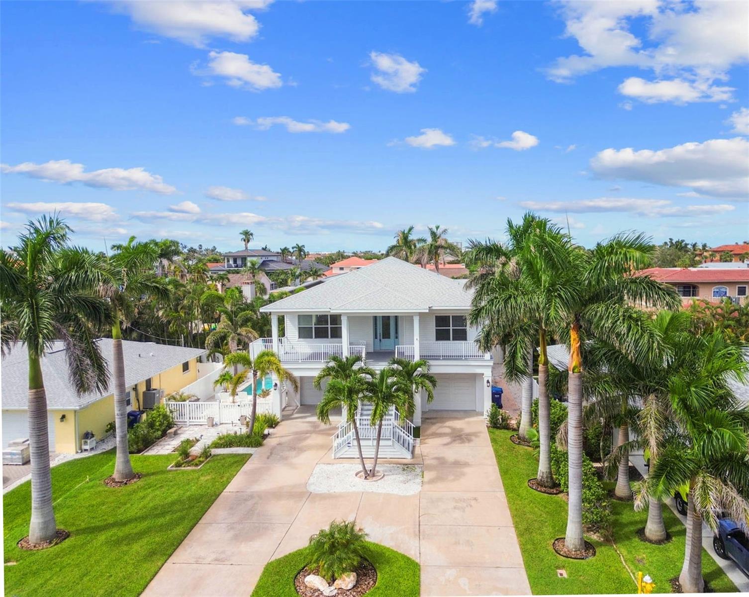 Live in one of the most exclusive beach communities on the west coast of Florida! Belleair Beach is home to less than 700 households and fewer than 1,700 residents with 3 private beach entrances featuring resident only parking. This elegant elevated custom built home features over 4,500 sq. ft. of living and entertaining space. Watch the sun rise over the intracoastal waterway in the morning and set over the Gulf in the evenings from the expansive 394 sq. ft. covered front porch. Ideally located only 5 houses from both the beach and intracoastal. Take a quick golf cart ride to the community center for tennis and pickleball or a short stroll and you’ll be fishing off the community dock one street away or head toward the Gulf and enjoy the private and exclusive beach access to the world-famous white sands.
This upscale home was custom built in 2016 to FEMA standards with a main floor elevation of 17.5 feet, so insurance costs are minimal.
Step inside and enjoy the light and bright living area with custom molding and fine detail work throughout. From vaulted cathedral ceilings, marble floors, and hand-scraped hardwood, to Abalone shell accent walls, the luxury of this home is impeccable. Built to detailed and exacting standards as a beach house for national television show hosts, the design boasts the ideal entertaining and living space that even includes an elevator. The 4-car tandem garage floor has new Polyaspartic flooring which is four times stronger than epoxy and perfect for the island lifestyle, pool entertainment room and gym. Just outside the double doors of the downstairs area is the custom pool with a splash pad, jets, and color changing fountains. If you’re looking for a beautiful, elevated beach house in the prestigious neighborhood of Belleair Beach, this move-in ready jewel is an investment for generations.
View the Matterport 3D walkthrough for a detailed view of the entire house.
All measurements are approximate and should be verified by buyers.