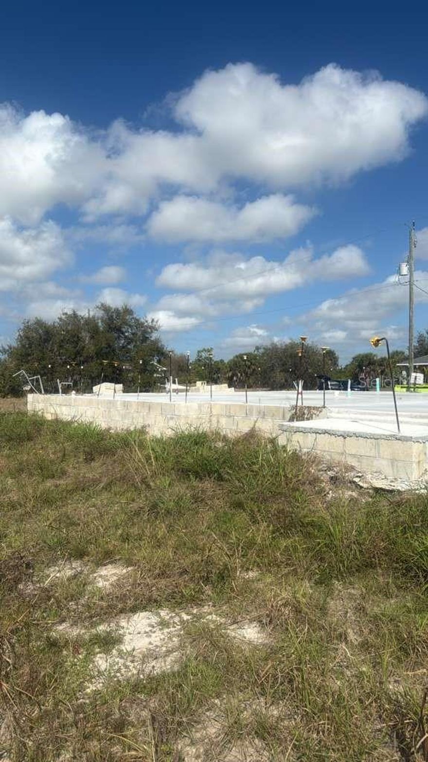 LOCATION!!! Build your dream home in an unbeatable setting. This prime lot is just minutes from beautiful beaches, golf courses, shopping, and dining. A public boat ramp with access to the Gulf of Mexico is only a few miles away, and public water and sewer connections are available.
Located in the highly desirable community of Rotonda Sands, this property is surrounded by well-maintained homes and ongoing new construction. The lot is cleared, with electricity available, making it ready for your future home.
Even better — significant savings already in place! The lot includes an existing slab and stem wall, helping you save time and construction costs. Approved plans are also available, allowing you to complete a thoughtfully designed home featuring 4 bedrooms, 2 bathrooms, a 2-car garage, 1,664 sq ft under air, and 2,113 total sq ft.
Enjoy a peaceful, relaxed setting while still being close to top-rated shopping, schools, beaches, and more.
Motivated seller — don’t miss this opportunity! This one won’t last!