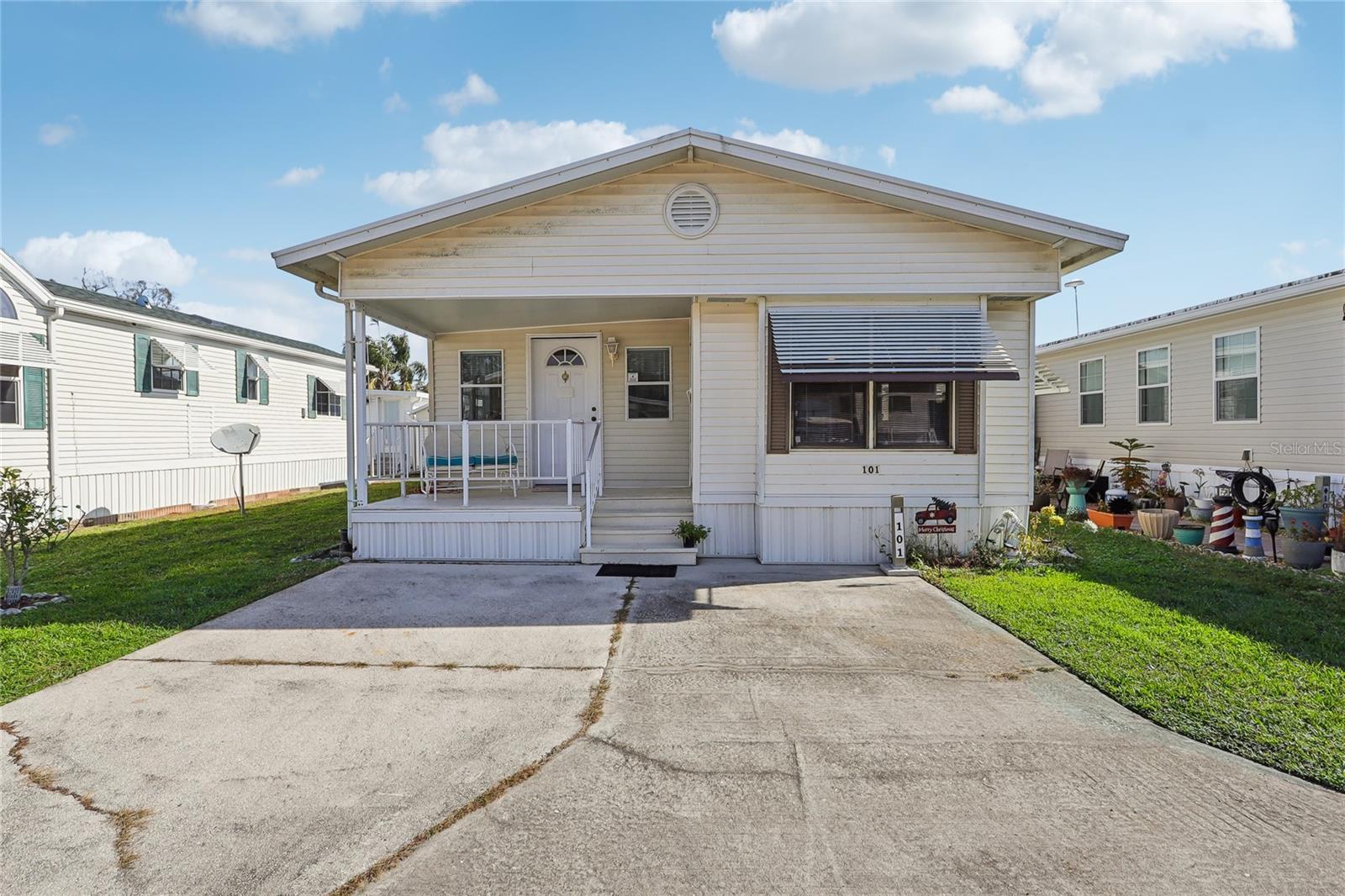 Welcome to Citrus Ridge, a charming 55+ community located in Davenport, and close to all the attractions and I-4! This
is NOT lot rent - you own the land! This home has had some recent updates and is ready for its new owners! NO
polybutylene piping--- the home was completely repiped! The floors are super solid as well! The home just needs your
finishing touches on design, but is move-in ready as is as well! Driving to the property, you'll notice the oversized
parking pad that can comfortably fit two vehicles. A front porch greets you, perfect for enjoying your morning coffee
on. When you enter the home, you'll enter the kitchen and dining room. There is eating space in the kitchen, and the
home is also set up with a desk and chair, perfect for a home office. Heading to the back of the main home, you'll find
the full bathroom, with a shower/tub combo, and the primary bedroom is at the back of the home. The living space
continues into the addition. Starting from the back, you have a second bedroom / den that features a closet with the
washer and dryer (yes, this has INSIDE laundry!). There is also a half bath, and then the living room in the front of the
home. Outside, you'll find a generous storage shed. The yearly HOA fee covers maintenance of the roads, pool and
other common areas, trash removal and lawn service. Owners are responsible for their trees, flowerbeds and other
plantings. Park amenities include three laundry and bath house buildings; heated swimming pool and spa; shuffleboard;
horseshoe court; and a petanque court. There is also a clubhouse for meetings, exercise class, shows, bingo, dances,
craft and flea market events, cards, luncheons and pot luck dinners and line dancing classes. Finally, there is an activity
hall for meetings, Bible study, library, reading room with puzzles, cards, exercise equipment room, arts and crafts,
private parties. You can find a calendar of events on the association's website.