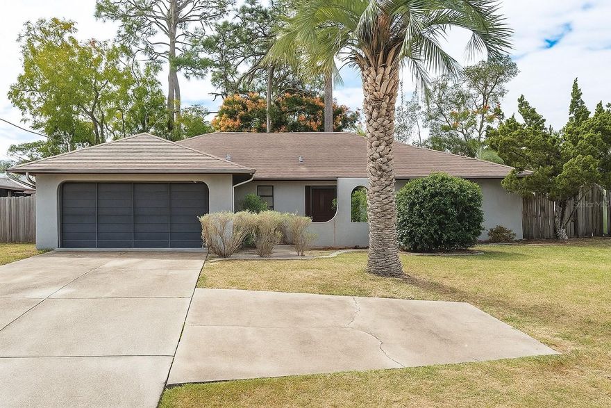 With over 1,500 sq ft of living space this 2 bedroom, 2 bathroom home is perfect with it's open floor, split bedroom floor plan. The oversized fenced in yard is an excellent feature offering mature trees for shade coverage. A large lanai space for relaxing and hosting your guests. You will be pleased to have your laundry room inside the house with built in storage features. The large two car garage offers sliding screen doors to allow for circulation and visibility while keeping insects out. Conveniently located and just minutes away from shopping, restaurants, Adventure Coast Fun Park, the library, and only 10 minutes to Hernando beach. Book your showing today!