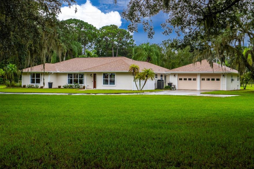 Your paradise on 2.5 acres in New Smyrna Beach! This spacious home on this large fenced in property has tons of updates including a new roof in 2018, new exterior paint, new gutters, and a new pool pump. This home features an inside laundry room, split floor plan, generator hookup, and termite bond through Massey.  The seller recently put in a rain water collection system moving rain water away from the house to areas around the yard. The home has an oversized garage and a detached workshop, so bring all of your toys! Relax in your private pool overlooking the lush landscaping. Your private paradise is waiting for you! Call for a showing today! ;Water: City