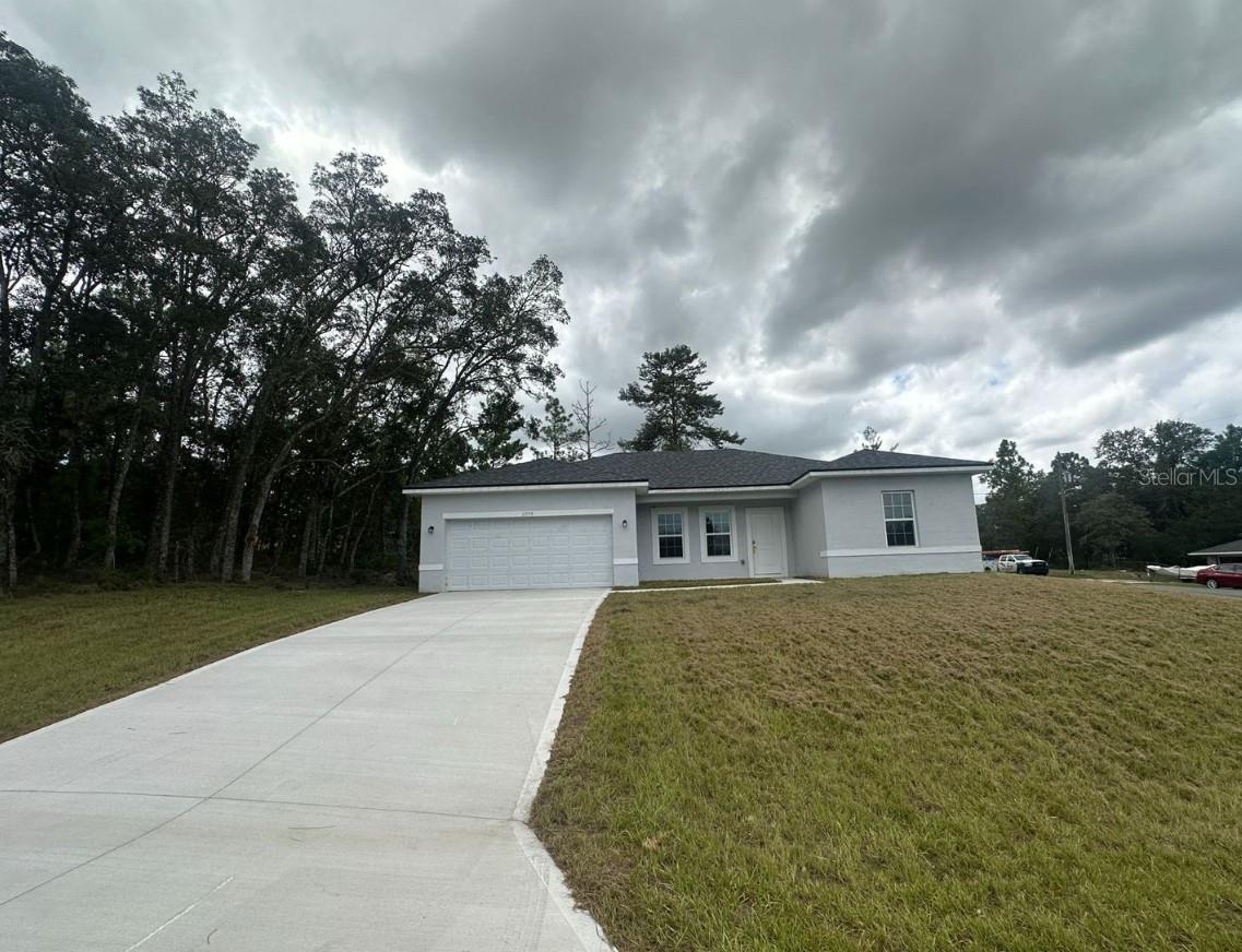 Spacious 4-bedroom, 2-bath home with a 2-car garage. Bright open floor plan, modern kitchen, and plenty of storage. Quiet neighborhood in Citrus Springs.