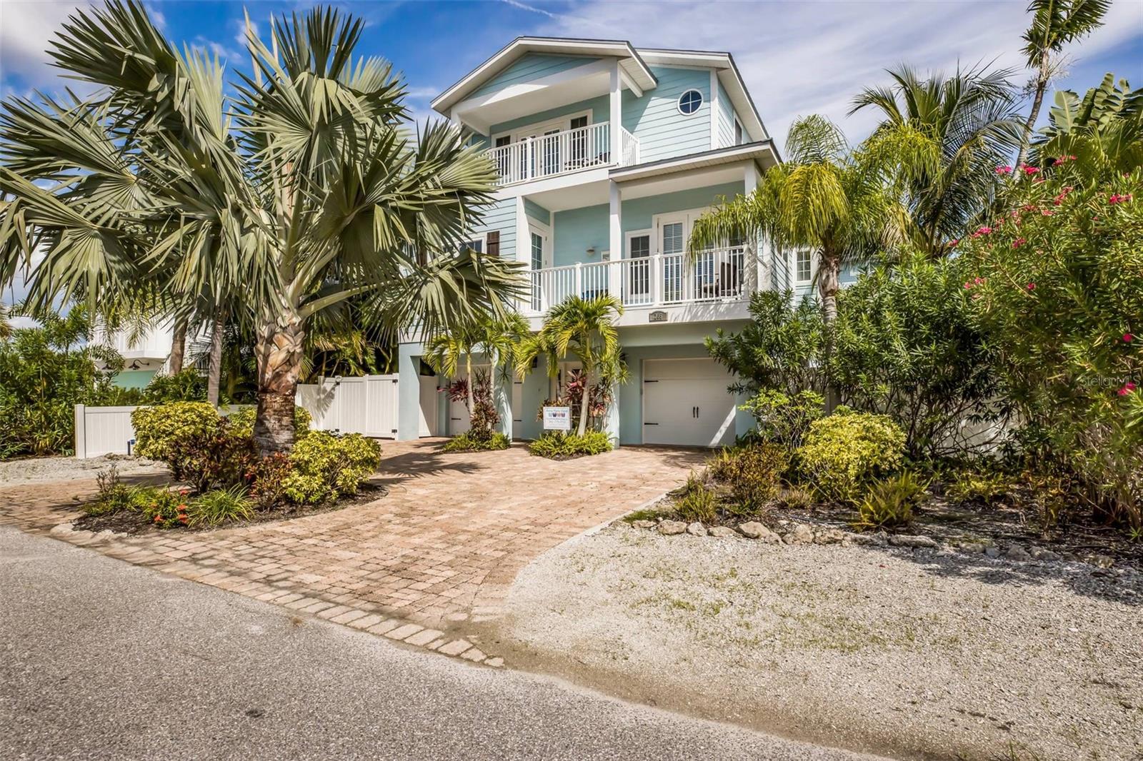 Nestled in the heart of Anna Maria Island and just a few steps from the world-famous sand beaches of Anna Maria Island, this spacious 5-bedroom, 4.5-bathroom home comes turnkey furnished, complete with charming furnishings that capture the essence of beachfront living. The open-concept design of the living areas is light and bright with vaulted ceilings, ensuring a seamless flow between the kitchen, dining, and living spaces. The kitchen is appointed with granite countertops, stainless steel appliances and solid wood cabinets. Enjoy your oversized master suite with huge walk-in closet, wet bar, and private deck with amazing sunsets and views. Mature tropical landscaping makes this home perfect for entertaining and soaking up the sun while you relax outside by the pool area. Multiple balconies and a rooftop terrace, ideal for enjoying sunsets and ocean breezes. Excellent island location close to shops, restaurants, trolley stop service which runs the length of Anna Maria Island and more! This is also a great rental investment as well. Call to get your private showing today!