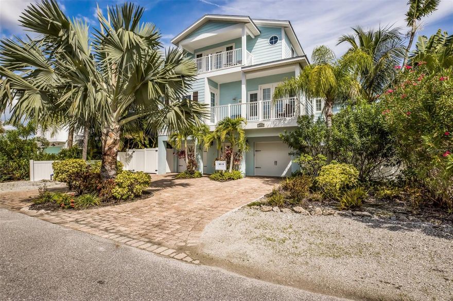 Nestled in the heart of Anna Maria Island and just a few steps from the world-famous sand beaches of Anna Maria Island, this spacious 5-bedroom, 4.5-bathroom home comes turnkey furnished, complete with charming furnishings that capture the essence of beachfront living. The open-concept design of the living areas is light and bright with vaulted ceilings, ensuring a seamless flow between the kitchen, dining, and living spaces. The kitchen is appointed with granite countertops, stainless steel appliances and solid wood cabinets. Enjoy your oversized master suite with huge walk-in closet, wet bar, and private deck with amazing sunsets and views. Mature tropical landscaping makes this home perfect for entertaining and soaking up the sun while you relax outside by the pool area. Multiple balconies and a rooftop terrace, ideal for enjoying sunsets and ocean breezes.  Excellent island location close to shops, restaurants, trolley stop service which runs the length of Anna Maria Island and more! This is also a great rental investment as well. Call to get your private showing today!