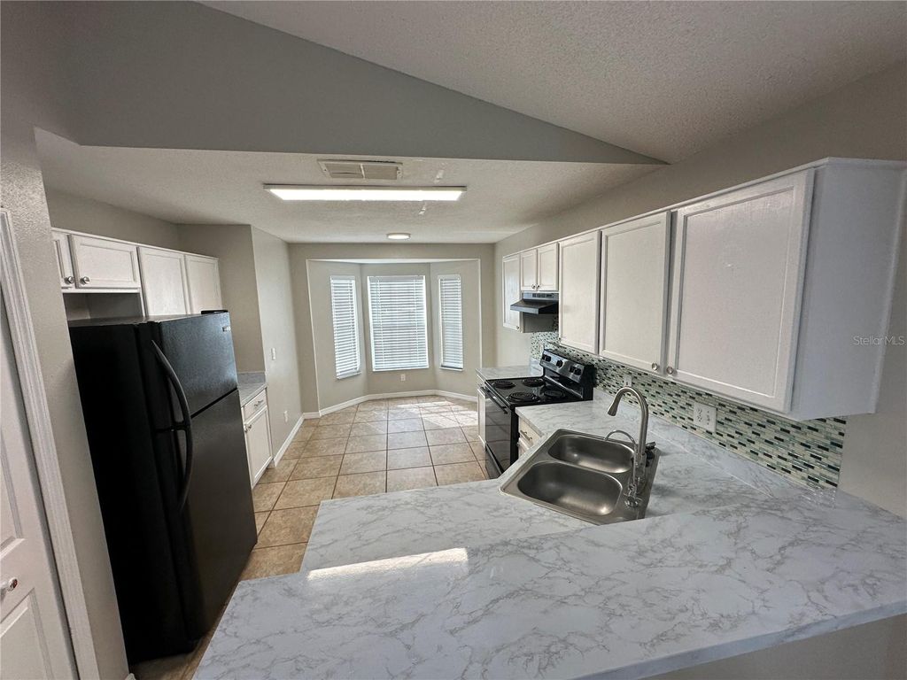 Photo of 13701 Meadowpark Avenue, Orlando, FL 32826 (MLS # O6404124)