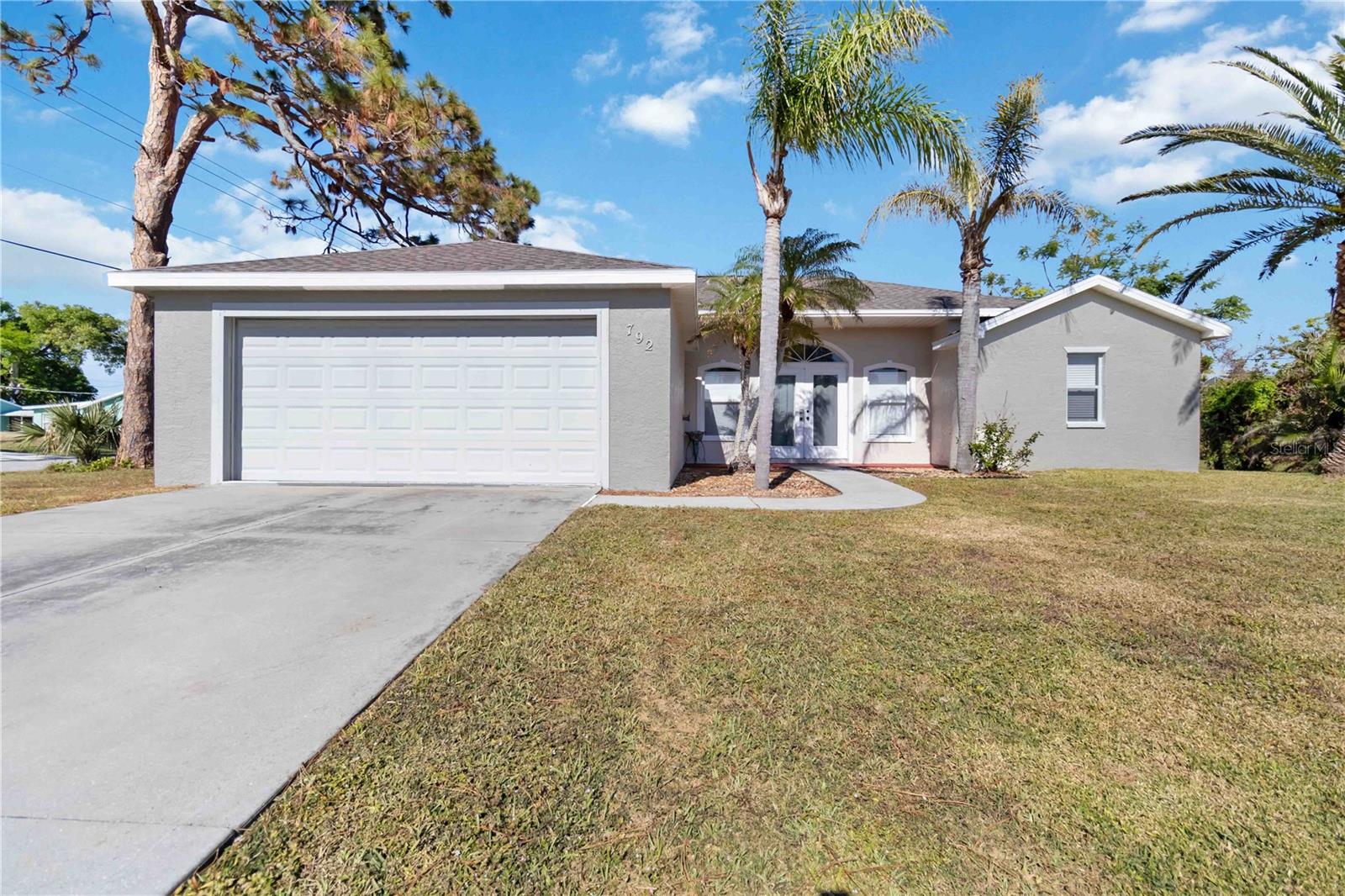 Be sure to be one of the first to see this great deal in the highly desirable South Venice area. Don't miss your chance to own this Beautiful 3 bedroom 2 bath with an additional under air FLEX SPACE (Perfect for a home office, man cave or craft room alike) home situated on a 100' WIDE CORNER LOT. Walking through the double door entrance, you can't help but notice the custom trim work found throughout the main living areas such as crown molding, chair railing, wainscoting and even the windows and doors are completely cased out. Check out those gorgeous luxury plank floors flowing to a well appointed kitchen with a huge pantry and ample amounts of counter and cabinet space. This home features a split floor plan with 2 sizeable guest bedrooms to the left and a large primary bedroom off to the right. The primary ensuite complete with a large walk in closet, showcases a newly renovated shower with subway tile and an updated vanity. Through the sliding glass doors you will find a great sized lanai that has an additional set of sliders allowing you the option and utility of year round usage. Off the lanai is where the additional flex room is located. Things to know before you go: New Roof 2023, A/C 2017, Brand New Never Used Water System, and Brand New Exterior Paint (Accessible Beige). This home is priced to sell, so don't let your South Venice Area Dream Home become someone else's address. Setup your showing today!