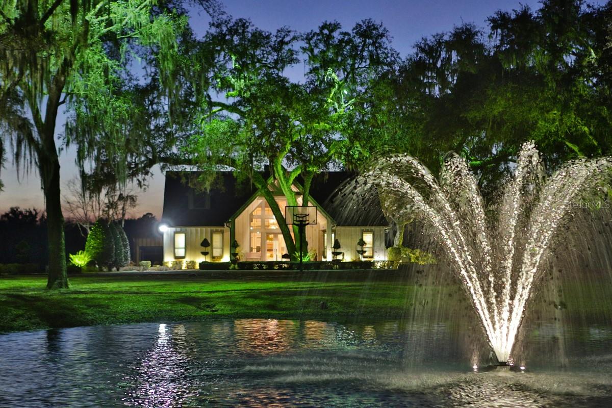 136+/- Acre estate, incredible features, State-of-the-Art Equine facilities, located in the NW part of Marion County. Professionally sculpted and architecturally designed main residence encompasses 4,000+ square feet of living area with 5 bedrooms and 4 baths overlooking your own private stocked lake. The luxurious interiors captivate you with immaculate and stylish clean lines, artistic flair, crown molding, high-end fixtures, and vaulted ceilings throughout. This home is also highly livable, practical, and comfortable with an exceptional floor plan and layout that makes it an oasis you don’t want to leave. Detached garage and 1 bedroom, 1 bath guest quarters. The INN offers 4,925 +/- SF and has been recently renovated with 8 en suite bedrooms. Top-of-the-line appliances, central meeting & dining areas, plus patios for meeting or small convention center, ample outdoor entertaining, and conversation areas. The equestrian facility includes a 5-stall isolation barn with 1/1 apartment. 25 Stall center aisle barn with a 4,900+/- sq ft covered area for a European free walker and hydrotherapy spa. The racetrack and covered equipment storage building are also located close to the training barn. 5/8 +/- Mile synthetic cushion training track with 50-foot wide banks and turns. This property is truly in a league of its own. Adding to the allure of this property are paddocks and private areas with magnificent trees set off by up lighting plus fiber optic cable for internet. You will discover a property with all the amenities which are too numerous to mention.
