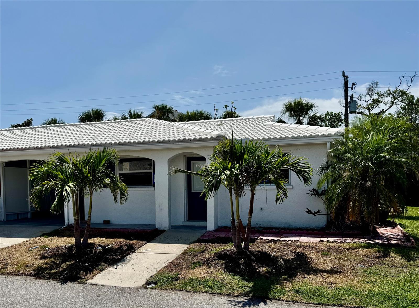 Welcome to this 2-bedroom, 2-bath villa located in the highly desirable 55+ community of Spanish Main Yacht Club on the north end of Longboat Key. Offering the perfect blend of privacy, potential, and location, this villa is ideal as a full-time residence, seasonal getaway, or investment opportunity. Enjoy exclusive access to the community’s private marina and secluded beach, just a short stroll from your doorstep. The villa features private outdoor space for relaxing or entertaining and has already undergone essential FEMA-approved storm mitigation updates, providing peace of mind and a strong foundation for future customization. Inside, the unit is ready for your finishing touches—an excellent opportunity to bring your personal style and vision to life in one of Longboat Key’s most scenic and sought-after areas. Whether you're soaking up the sun, strolling along the shoreline, or docking your boat after a day on the water, this community offers the quintessential Florida lifestyle.