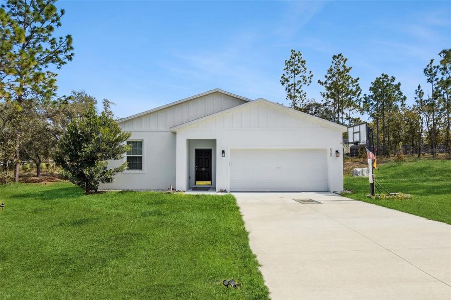 Welcome to this inviting 3-bedroom, 2-bathroom home perfectly situated on a corner lot just shy of an acre! Step inside through the spacious foyer featuring tile flooring that flows seamlessly throughout the main living areas. The open-concept layout combines the living, dining, and kitchen spaces—ideal for both relaxing and entertaining.

The kitchen boasts stone countertops, stainless steel appliances, a pantry, and a large island with additional seating. Enjoy the split bedroom floor plan, offering privacy with the primary suite tucked away at the back of the home. The primary bathroom features double vanity sinks and a stand-alone shower. At the front of the home, you’ll find two additional bedrooms and a full bathroom with a tub/shower combination.

From the living area, sliding glass doors open to a covered lanai overlooking the expansive backyard—perfect for outdoor gatherings or simply enjoying the peaceful setting. Additional conveniences include a laundry room with washer and dryer, and a 2-car garage.

With no HOA, you’ll have the freedom to enjoy your property as you please. Conveniently located just a short drive to Dunnellon for shopping, dining, medical offices, and the beautiful Rainbow River, and only 20 minutes to Ocala—home to the renowned World Equestrian Center, as well as endless dining and entertainment options.

Don’t miss this opportunity to own a spacious home on a large lot in a fantastic location!