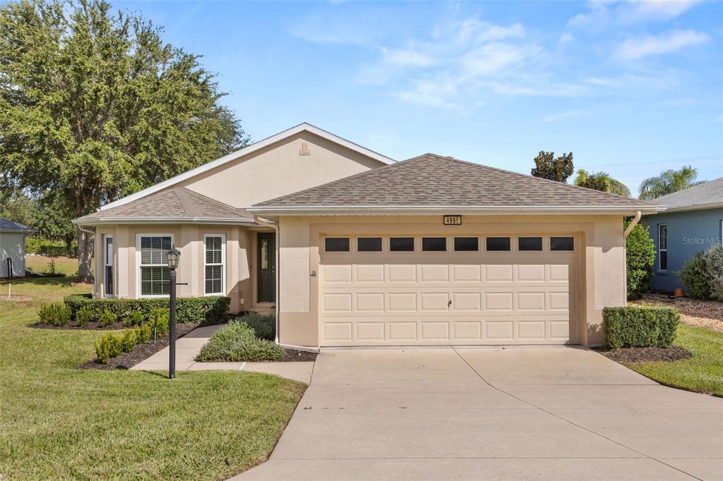 Photo of 4991 Portsmouth Street, Tavares, FL 32778 (MLS # O6454036)