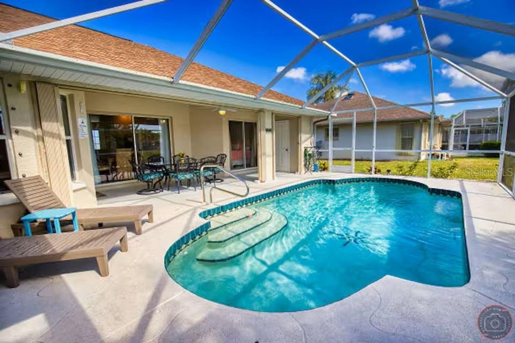 Photo of 118 Broadmoor Lane, Rotonda West, FL 33947 (MLS # A4694711)