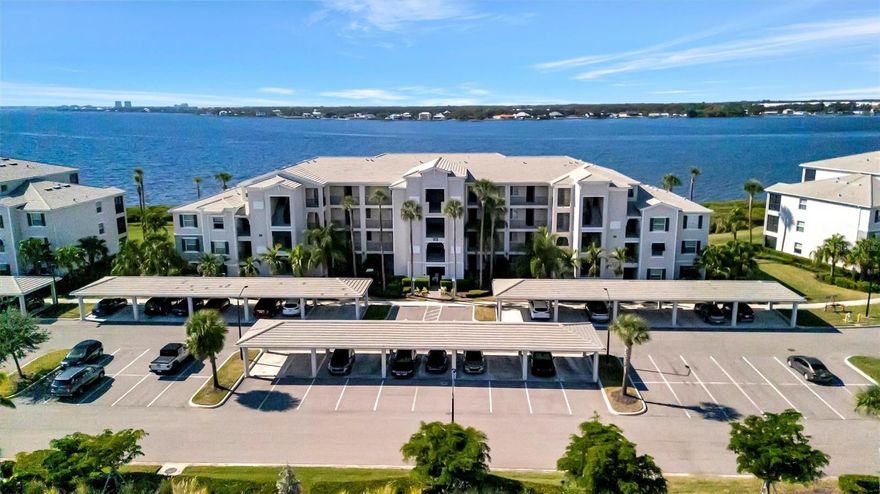 Enjoy nightly sunsets, watch boats drift by, and spot dolphins swimming—all from your window or private balcony. Tidewater Preserve is one of Bradenton’s most sought-after riverfront boating communities along the scenic Manatee River! This 4th-floor, fully furnished 2-bedroom, 2-bath penthouse condo—accessible by elevator or stairs—features hurricane impact windows and offers breathtaking panoramic water views. The kitchen showcases quartz countertops, stainless steel appliances, and ample cabinet space. The primary suite includes a walk-in closet, wall-mounted TV, and an en-suite bath. Tile flooring flows through the kitchen, living, and dining areas, with plush carpet in the bedrooms for added comfort. Additional conveniences include central A/C, an in-unit washer and dryer, a covered parking space, and a private storage unit—where beach chairs, an umbrella, and a cooler are ready and waiting for your next waterfront adventure. Experience resort-style living with amenities that include a marina, three sparkling pools, two fitness centers, a clubhouse, tennis courts, a dog park, and scenic riverfront walking trails. Launch a kayak directly into the river or explore the option to secure a boat slip at the marina. Tidewater Preserve is a 24-hour guard-gated community, providing peace of mind and a true lock-and-leave lifestyle.