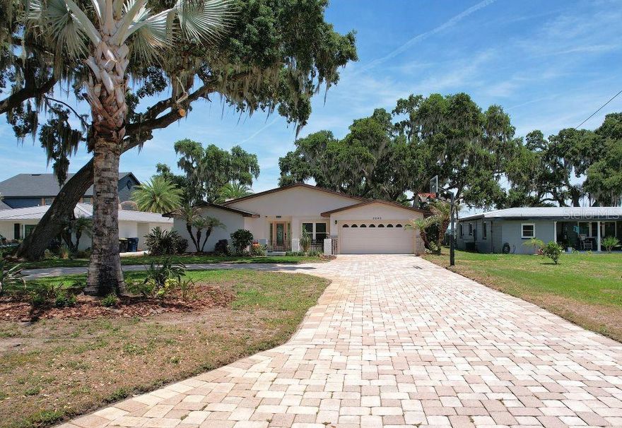 Welcome to lakefront living on beautiful Lake Ariana in Auburndale! This spacious 4-bedroom, 3-bath home offers over 3,000 square feet on more than half an acre and not in a flood zone! The home boosts a desirable split floor plan, oversized living room, separate family room and plenty of room for entertaining. Enjoy breathtaking views and an oversized backyard leading directly to the water and a brand new private boat dock! Conveniently located near the newly redesigned Lake Ariana Park and Civic Center, offering recreation, playground, and community amenities just minutes away. Home is situated on a separate access road adjacent to a main roadway for convenient access.
New roof at closing!