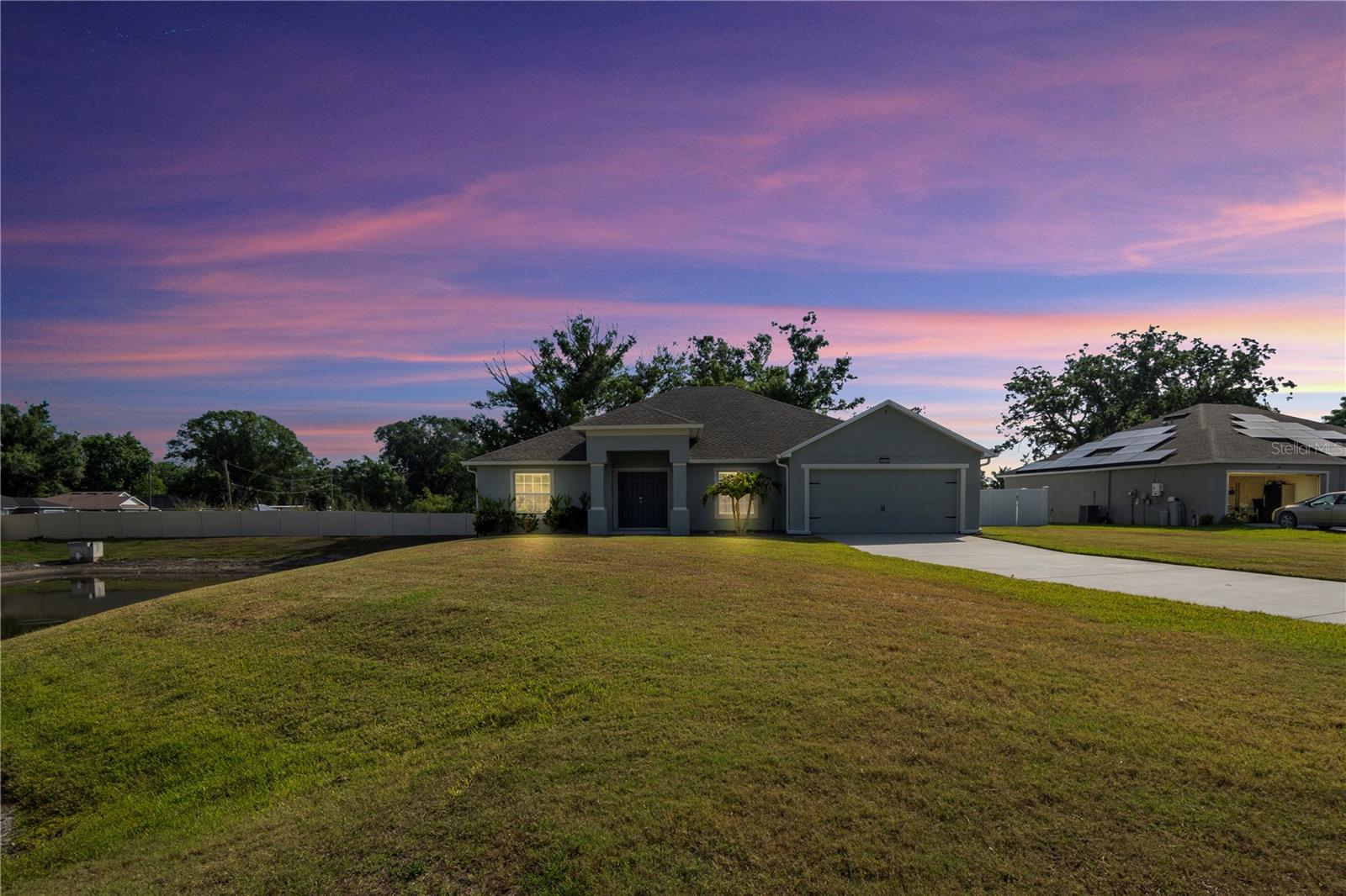 MOTIVATED OWNERS! Welcome to 230 Cove at Eagle Lake Circle — a beautifully maintained 4-bedroom, 3-bathroom home built in 2022 by Southern Homes, located on a spacious 0.34-acre corner lot in the desirable gated community of The Cove at Eagle Lake.
HOME FEATURES: • Open Layout for Easy Living: This thoughtful, open-concept design makes entertaining a breeze and daily living feel effortless. The spacious living area flows naturally into the dining space and kitchen.
• Stylish Kitchen: Featuring stainless steel appliances, ample cabinet space, large walk-in pantry, and bar seating that opens into the living room — perfect for casual meals or hosting guests.
• Private Primary Suite: Retreat to your generously sized primary bedroom, complete with an en-suite bath and a spacious walk-in closet. Simple, functional, and serene.
• Flexible Living Spaces: With 4 well-sized bedrooms and 3 full bathrooms, there's space for family, guests, a home office—or all three!
• Oversized 2-Car Garage: Extra room for storage, tools, or hobbies with a generous 568 sq. ft. garage.
• Outdoor Bonuses: Step out to the screened-in back porch and take in your fully fenced backyard, perfect for relaxing or entertaining. Two storage sheds offer even more flexibility, and a double gate entrance makes it easy to tuck away a boat, trailer, or extra vehicle—out of sight and HOA-compliant!
COMMUNITY AND LOCATION: Gated community with low annual HOA of $900. Convenient to Winter Haven, shopping, dining, and Polk County schools. Easy access to US-17, downtown Winter Haven, Legoland, and nearby Chain of Lakes
This home offers the best of modern construction, privacy, and practicality—without the wait of new construction. Don’t miss this opportunity to own a nearly new home with space to spread out, park your toys, and enjoy Florida living your way! CHECK OUT THE 3D VIRTUAL TOUR AND VIEW THE HOME 24/7! OR •• Schedule your private showing today! ••