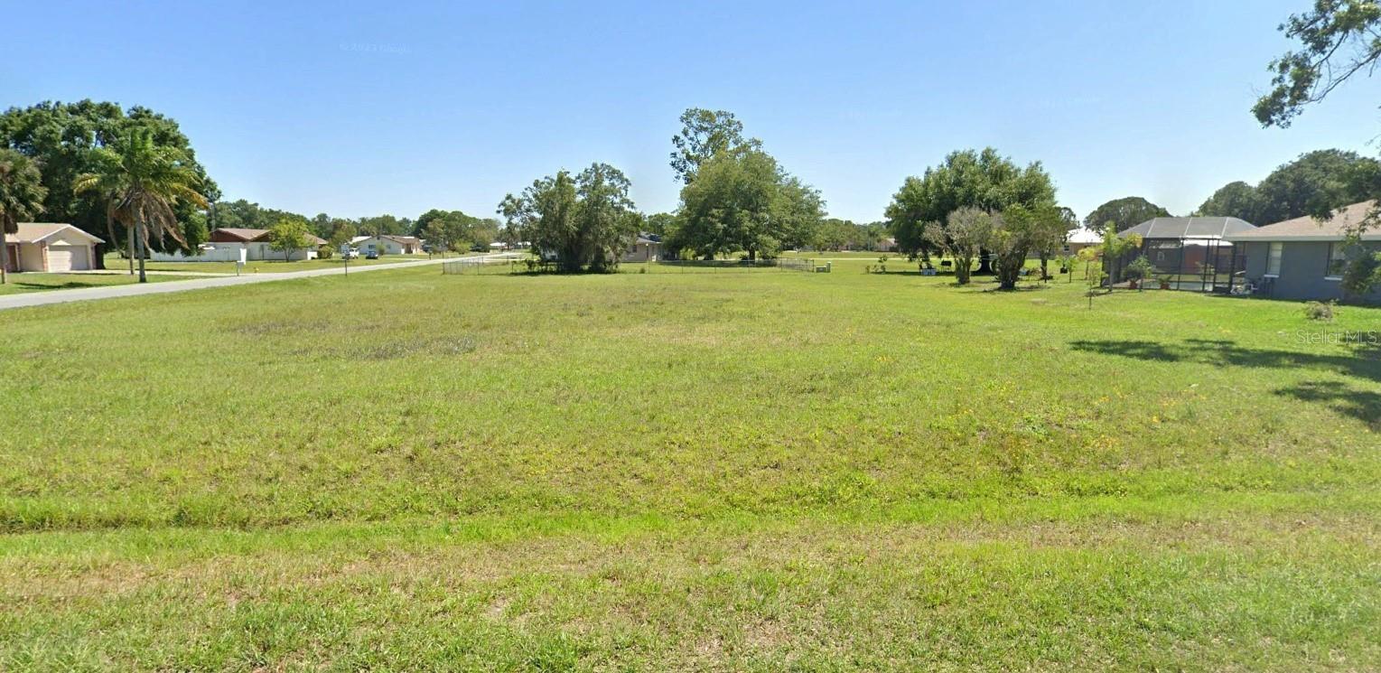 Welcome to 7016 Coral Ridge Road, Sebring, FL—a prime residential lot located in the desirable Oakwood Villas neighborhood. This spacious 0.55-acre property (125’ x 191’) offers the perfect opportunity to build your dream home or next project in one of Sebring’s most scenic and established communities. With nearby power and central water available, the path to development is straightforward and efficient, making this lot an excellent choice for those ready to turn plans into reality. Set within the peaceful surroundings of Spring Lake, this property delivers both tranquility and convenience. Imagine designing a home that fits your vision, with plenty of room for outdoor living, gardens, or a private backyard retreat. Minimal clearing is needed, giving you a head start on construction and allowing you to bring your vision to life more quickly. Location is everything, and this lot delivers on all fronts. Just a short distance away, you’ll find Spring Lake Golf Course, a well-loved public course that also offers tennis and pickleball courts. Walking trails, green spaces, and neighborhood parks provide endless opportunities for fresh air and recreation. Whether you’re perfecting your swing, enjoying a morning walk, or relaxing in a natural setting, the neighborhood is designed to make outdoor living enjoyable year-round. For those who love the water, Lake Istokpoga—a massive 27,000-acre freshwater lake—is just minutes away. Known as one of Florida’s premier fishing and boating destinations, the lake provides opportunities for adventure, from bass fishing to kayaking and more. Situated in Sebring, a city known for its charm and central Florida location, this lot also offers easy access to local shops, dining, and major roadways. It’s a perfect balance of peaceful neighborhood living with nearby conveniences. 7016 Coral Ridge Road is more than just a lot—it’s a canvas for your future. With its generous size, established utilities, and proximity to golf, parks, and lakes, this property is a rare opportunity in Sebring’s Spring Lake community. Don’t miss your chance to secure this piece of Florida paradise.