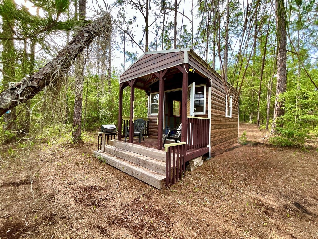 Photo of 125 Silver Dollar Pond Road, Hawthorne, FL 32640 (MLS # GC541335)
