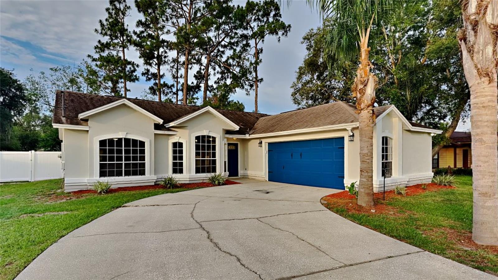 Welcome to this lovely 3 bedroom 2 bath that has a fenced in backyard and a deck for entertaining and relaxing. Walk in to a freshly painted, beautifully designed, open concept home that features a split floor plan, vaulted ceilings, new lighting, and new carpet in the bedrooms. Enjoy cooking in your gorgeous updated kitchen that boasts newer cabinetry, SS appliances, bay windows, tiled backsplash, quartz countertops, with large quartz island that has a farmhouse sink and plenty of room for enjoying company. The dining area features a chandelier and bay windows, and the walk in laundry room has a line closet for storage. The guest bathroom has a newer vanity with quartz countertops, newer mirror and lighting, and tiled surround. Your master suite has a ceiling fan and walk in closet and your updated master bathroom features dual sinks, quartz countertops, newer mirrors and lighting, and walk in shower with tiled walls. This home has a new 2023 AC, 2018 roof, a newly painted garage, is close to restaurants, parks, and the I-4 Hwy. Book a private showing and come see this home today.