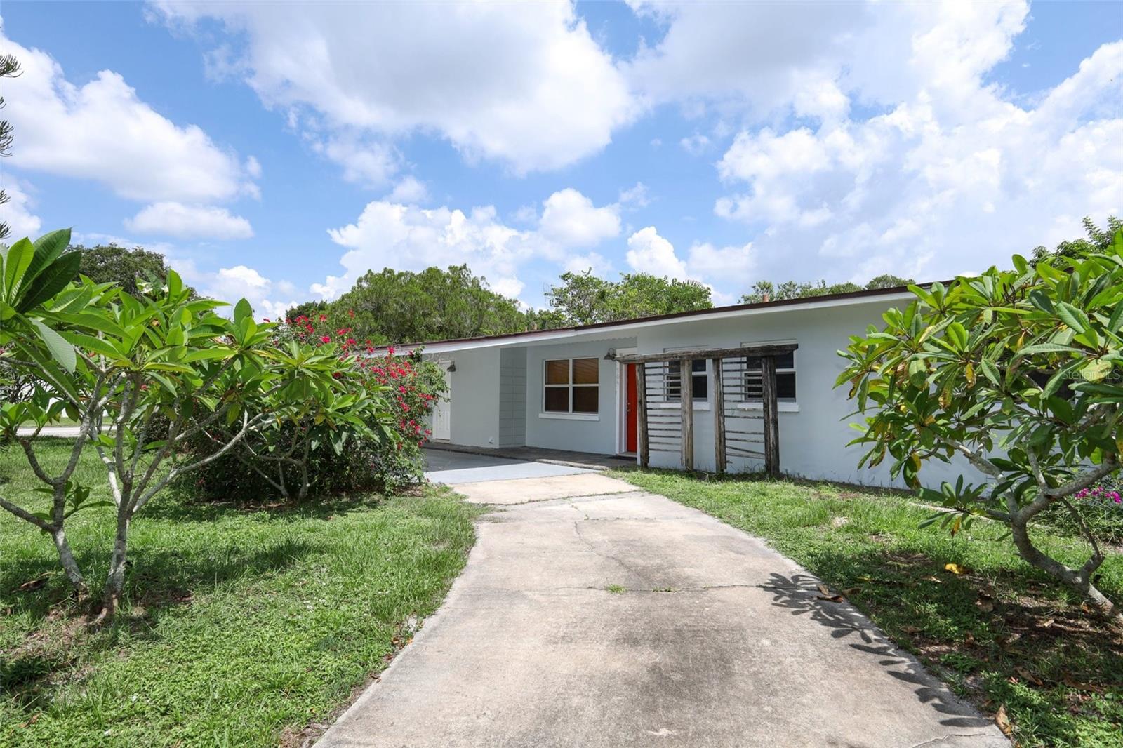 Welcome to 904 Hall Street, a quaint single-family home situated on an oversized corner lot in a welcoming and established neighborhood. The property is surrounded by lush mature landscaping that includes vibrant plumeria and producing mango trees, creating a tropical and tranquil setting. A curved dual-entry driveway provides both charm and functionality, guiding you to a home full of thoughtful updates and inviting spaces. Inside, the home offers a comfortable three-bedroom, two-bathroom layout with a natural flow between rooms. The living and dining areas are designed for easy living and entertaining, complemented by a breakfast nook off the kitchen and a separate utility room that connects conveniently to the carport. French doors open to a large screened-in patio with open-beam ceilings, offering a peaceful retreat ideal for relaxing with views of the landscaped yard. The primary bedroom features its own private bath, and all bedrooms include ample closet space. This home has a newer roof and has been updated with important system improvements, including an air conditioning system & a whole-home water filtration system installed in 2019, carpets replaced in 2023 and new plumbing completed in 2024. A detached storage shed provides additional space for tools, hobbies, or equipment, while the surrounding yard offers room to garden or simply enjoy the shade and beauty of mature Florida foliage. Centrally located between downtown Melbourne, local shopping centers, and area schools, this home provides easy access to daily conveniences and community activities. A public golf course is just a few blocks away, making it ideal for those who enjoy outdoor recreation. Boating and fishing enthusiasts will enjoy the close proximity to several public boat ramps, including Front Street Park, Ballard Park, and the Eau Gallie Causeway, all offering access to the Indian River Lagoon and excellent options for launching a boat, fishing, or enjoying waterfront views. This property combines comfort, character, and a desirable location, making it an excellent choice for primary residency, vacation living, or investment property. Schedule your private tour today!