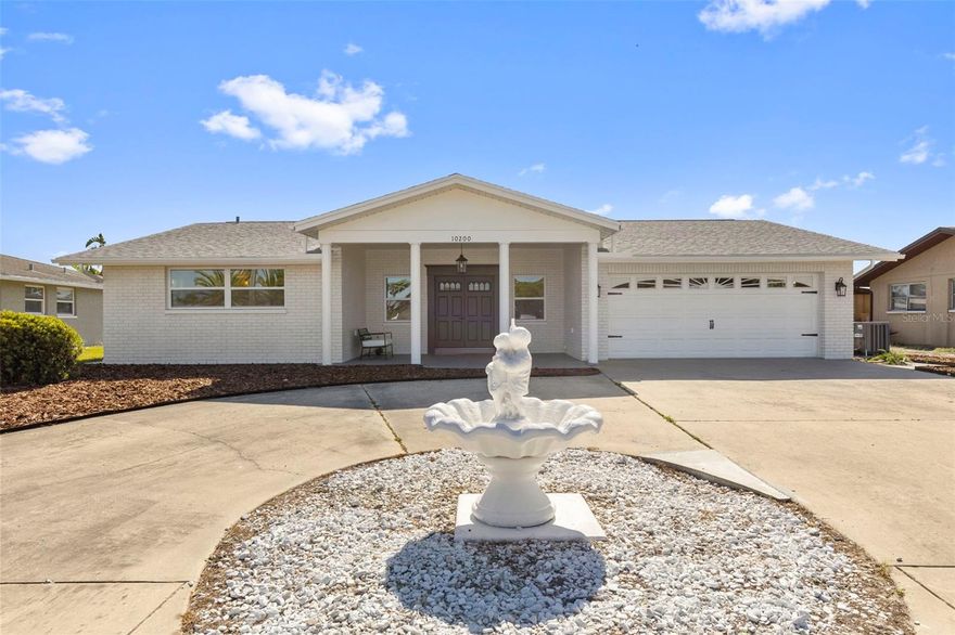 Enjoy breathtaking water views from this beautifully updated home—no flood insurance required! Offering nearly 1,700 sq ft of living space, this property features a versatile layout with two spacious primary suites, each with its own private bathroom, plus two additional well-sized bedrooms and an extra full bath—ideal for large families, multi-generational living, or income-producing potential.
The home has been thoughtfully renovated with high-quality finishes throughout, including a modern kitchen with updated cabinetry and appliances, durable luxury vinyl flooring across the entire home, new roof (2022), AC (2024), and new water heater—providing comfort and peace of mind for years to come.
Step outside to a huge enclosed Florida room, perfect for relaxing or entertaining while enjoying serene pond views. The backyard offers a tranquil setting with a large concrete dock, ideal for fishing, unwinding, or simply taking in the peaceful waterfront scenery.
Additional features include a double garage and meticulous attention to detail throughout the property. Whether you’re looking for a primary residence or an investment opportunity, this home combines space, upgrades, and an unbeatable view in one exceptional package.