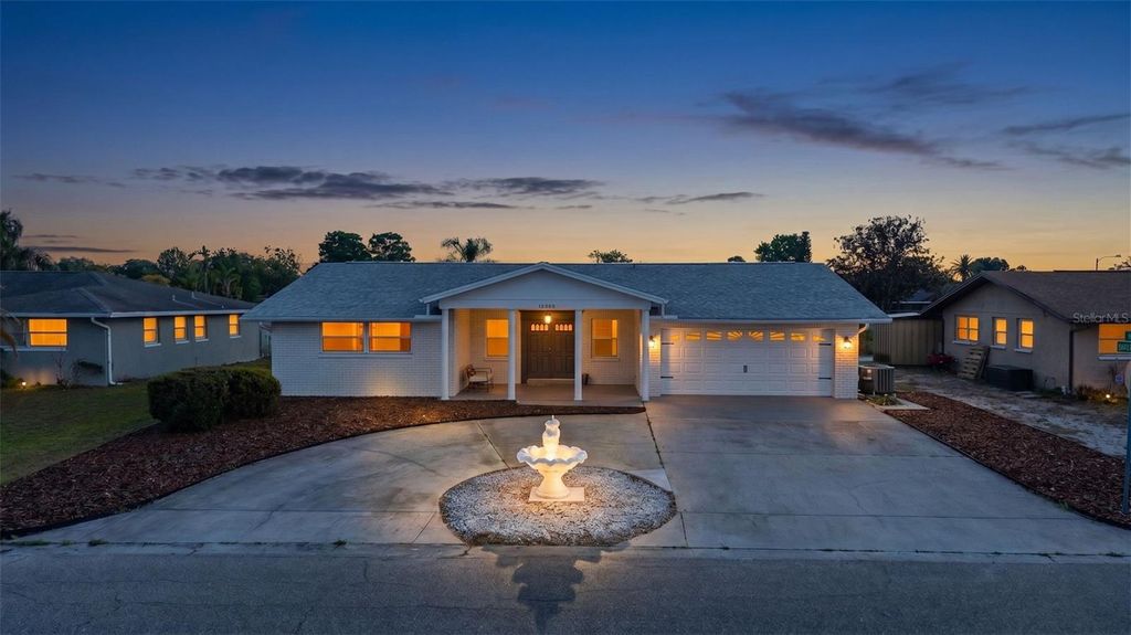 Photo of 10200 Amadeus Drive, Port Richey, FL 34668 (MLS # TB8503080)