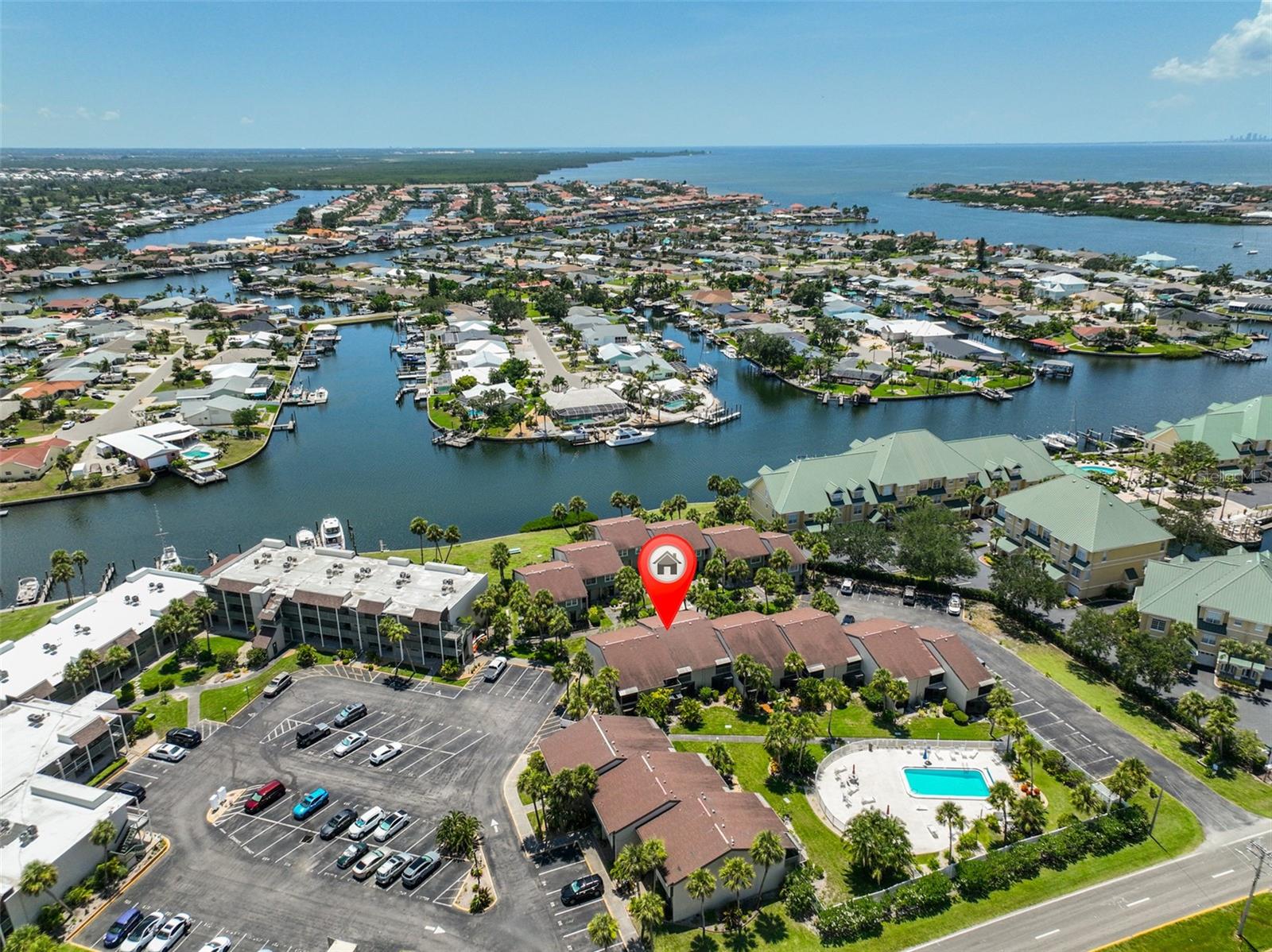 The waterfront community of Anchor Point has a lovely 2 bedroom, 2 bathroom fully furnished turn key townhouse style condo unit for sale. This is the perfect unit to call home, use as a second home or as an investment for monthly rental. The unit has been updated with easy care wood look ceramic plank tile throughout the first floor. New shaker style white cabinet, granite countertops, white subway tile backsplash and pots, pans, dishes, utensils, and appliances make the kitchen bright and efficient. There is a large pantry and extra storage under the stairs. The kitchen leads to the comfortable dining and living area and cozy screened lanai with outside storage. The 2 bedrooms featuring a primary suite with a walk in closet, full bathroom, and a private balcony, an additional bathroom and a laundry closet with a full sized washer and dryer and linen closet complete the upstairs.
Cool off with steps to the community pool or gather with friends in the community center with indoor and outdoor spaces available. Sit by the water and check out the dolphins and other sea life.
Docks are available for $170/month. (Best bargain around!)