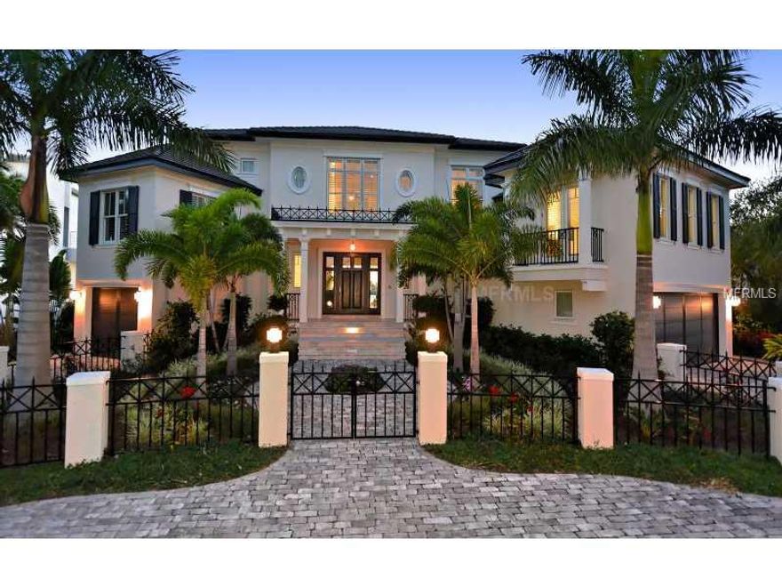 NEWLY-BUILT HOME! This exquisite 4 bedroom, 4.5 bath bay front home in Bird Key was just completed in 2012 by luxury custom builder, Murray Homes. Barely lived-in, you will relish the experience that new construction and custom features offer. With more than 5,500 square feet of living space, this designer home offers spacious en-suite bedrooms, an office, media room, kitchen/family room with breakfast nook and much more. Lush, manicured landscape, pavered circular drive and a secure gated entry greet you. The formal living room is a flourish of designer details, including Mahogany hardwood flooring, fireplace, statuesque columns and a wall of floor-to-ceiling glass showcasing far-reaching bay vistas. The chef's kitchen is sure to impress even a novice cook; with custom lighting, granite countertops, stainless steel appliances and wine cooler. The master suite is a wonderful retreat conveniently located on the first level. Featuring a spa-inspired bath with a private outdoor shower, walk-in closet, picturesque bay views and direct access to the lanai. The designer pool with a waterfall feature, surrounded by a marble deck with stainless steel Wolf grill, is the ideal location for any gathering. This home's impressive interior is matched only by the wonderful outdoor features, including a new dock with bench seating, lift, shore power hook-ups and newer seawall. Situated on deep sailboat water with no bridges blocking your direct access to the Gulf, this captivating home is the best of both worlds.