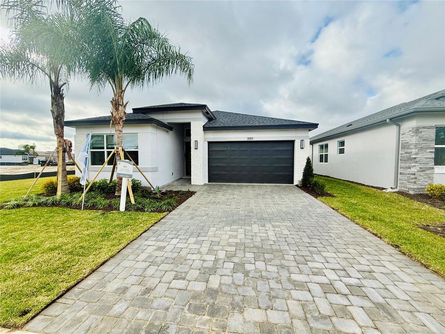 Under Construction. New Listing! Experience luxury active adult living in this new construction single-family home by GL Homes located in the highly desirable Valencia Ridge community in bustling Wesley Chapel. Seller will pay one full year of HOA dues (current monthly HOA $349; total value $4,188). List price includes a $15,000 seller incentive, contingent upon using the seller’s preferred lender and title company or paying cash.
This thoughtfully designed 1,807 sq ft open-concept floor plan showcases upscale finishes and modern convenience throughout. The chef-inspired kitchen features quartz countertops with a matching 4" backsplash, wood cabinetry with 42" upper cabinets, and a stainless steel GE® appliance package, including a 23.5 cu. ft. side-by-side refrigerator, 30" free-standing gas range, over-the-range microwave, and multi-cycle power scrub dishwasher. Additional highlights include a ventilated pantry closet, dual-compartment stainless steel undermount sink with pull-out faucet, food waste disposal with convenient countertop air on/off switch, and a recessed LED lighting package.
Valencia Ridge is a premier 55+ resort-style community designed for an active, social, and maintenance-free lifestyle. Residents enjoy an exceptional array of luxury amenities including a resort-style pool, three lighted tennis courts, eight lighted pickleball courts, outdoor bar and fireplace, state-of-the-art fitness center, full-service restaurant, elegant indoor lounge with bar, event rooms, massage room, and a sports lounge. Every detail is thoughtfully curated to create the ultimate amenitized lifestyle for active adults.
Ideally located near shopping, dining, and major roadways, this move-in-ready home offers the perfect blend of luxury, lifestyle, and value in one of Wesley Chapel’s most sought-after 55+ communities.