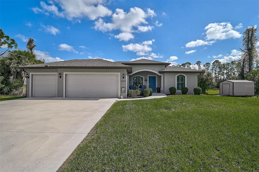 Experience Florida living at its best in this beautifully maintained 3-bedroom, 2-bathroom, 3-car garage custom home built in 2020. Situated on an oversized 0.69-acre lot in Flood Zone X, this property offers privacy, space, and peaceful views from the covered lanai. Enjoy a large screened pool area featuring a heated saltwater pool, paver deck, and plenty of room for outdoor relaxation. Inside, the kitchen includes upgraded cabinetry and a reverse osmosis water filtration system under the sink. Additional features include tile shower floors, interior window shutters, full-perimeter gutters, and hurricane-impact windows. The extended driveway with an 80-foot culvert and oversized parking area provides exceptional convenience. This home combines comfort, quality, and thoughtful design—ready for its next owner to enjoy.