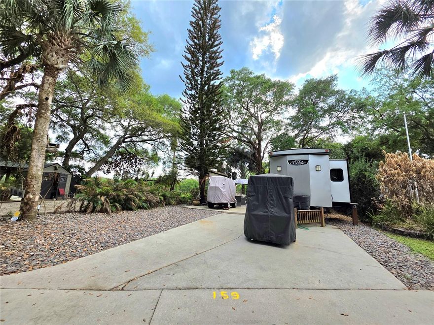 Welcome to 159 Horseshoe Bend, a beautifully maintained RV lot located in Phase 2 of River Ranch RV Resort- offering privacy, comfort, and plenty of outdoor living space.

This Luxury RV Lot is ideal for those seeking a turnkey outdoor setup with ample room to relax, entertain, and enjoy the peaceful surroundings of River Ranch RV Resort.

No rear neighbors gives added privacy & scenic views.   Perfect for outdoor entertaining with multiple seating areas, a Fire Table, and a relaxing swing; Plentiful natural shade in addition to retractable awnings for extra comfort, Grill included. Full-sized storage shed conveys

**RV sold separately**
**Golf carts and Blackstone do NOT convey**