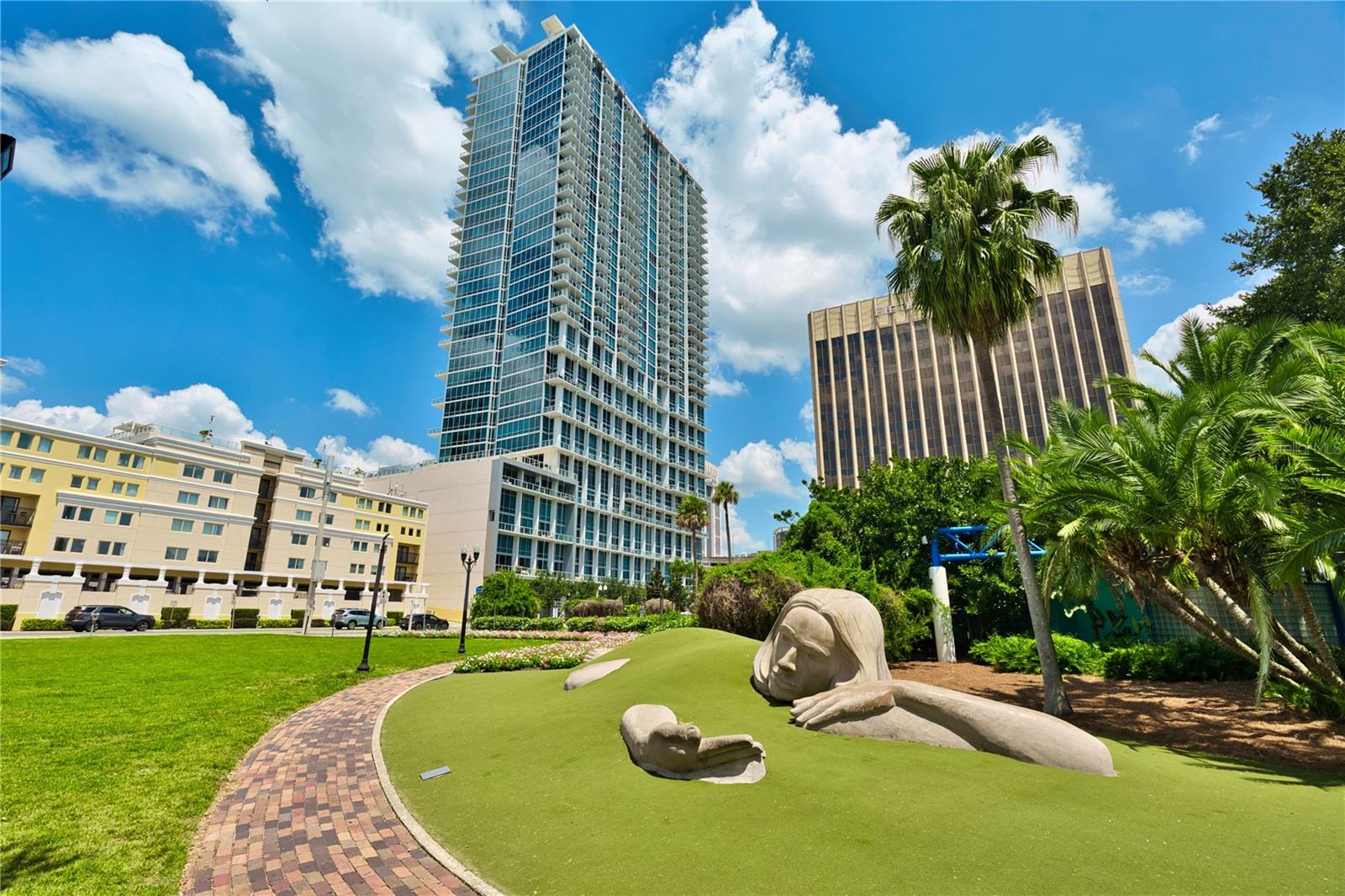 Elevate your lifestyle in this stunning 2-bedroom, 2-bath residence perched on the 30th floor of The Vue, one of Downtown Orlando’s premier high-rise communities. Enjoy breathtaking west-facing views of spectacular sunsets, the city skyline, and nightly theme park fireworks from your private balcony. The floor-to-ceiling windows, now enhanced with motorized blackout shades in both the primary suite and main living area offer effortless comfort and privacy at your convenience. This sleek, modern condo features an open-concept layout, high ceilings, engineered flooring, a sleek modern kitchen with granite countertops outfitted with new GE stainless steel appliances including a double door refrigerator, dishwasher, and microwave. The space flows seamlessly into the open living and dining area—perfect for entertaining the freshly updated guest bathroom features a 5 drawer; double door vanity topped with elegant Carrara marble. The primary suite offers a spacious bathroom with separate tub and shower, with two custom designed closets, one closet is set up as a home office nook. Located just off the foyer, find a utility closet with a LG Wi-Fi enabled washer/dryer combo. The Vue offers unmatched amenities including 24-hour concierge, valet, 2 conference rooms, cyber café, media room/theatre, an Olympic-size heated pool, tennis courts, a state-of-the-art fitness center, yoga studio, and a dog park. The on-site parking garage features 3 electric charging stations and a car wash area. Located steps from Lake Eola, dining, shopping, and entertainment, this is urban living at its finest. Whether you’re looking for a vibrant city lifestyle or a luxurious retreat in the sky, you’ll find it here. See attachments for a list of amenities and upgrades