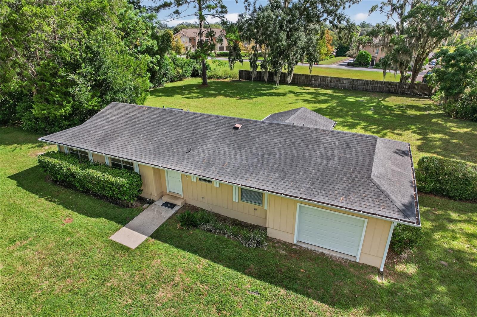 Let optimal location and convenience work for you with this solid 3-bedroom, 2-bathroom home on an acre in an established no-HOA neighborhood just off Archer Rd. If you are a biker this is a prime spot with instant access to the Archer Braid trail and if you commute east in the morning for work, you would be on the south side of Archer Rd and can zip right out to work. This home features a roof installed in 2015 as well as a hot water heater and AC unit from 2016. This summer, the home received a makeover with fresh interior paint, new LVP flooring throughout the living spaces, updated blinds, a serviced and cleaned AC unit, cleaned ducts, butcher block countertops, a new kitchen sink with faucet, and a brand-new stove. The home is on septic, with GRU water, and Clay for electric. With the wood siding in excellent condition, this would be a smooth purchase for all types of mortgages; conventional, FHA, VA, and USDA! No flood zones to worry about either! This is such a prime spot and with a full acre adorned with mature trees and grass, you can feel like you have a great parcel of land without sacrificing any of the modern conveniences that Gainesville has to offer. With the updates the home received this summer, this is a move in ready property with nothing to add to your to-do list except unpack and enjoy the home and land. Make an appointment to see this desirable home today!
