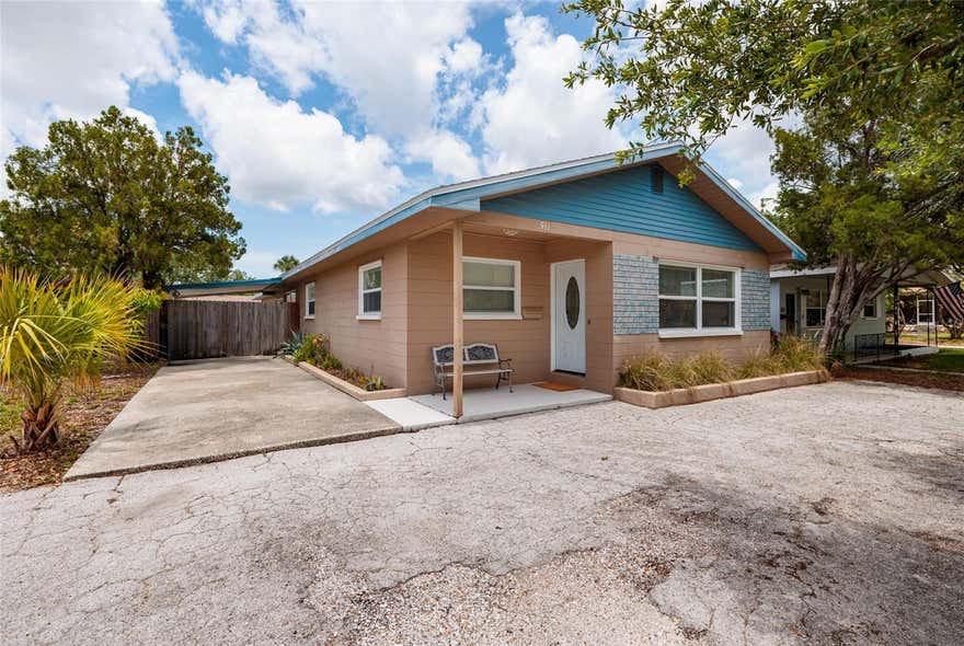 This beautifully maintained two-bedroom, two-bath pool home offers a bright, open layout and a private outdoor retreat in a prime location. The living, dining, and kitchen spaces flow together seamlessly, with the kitchen featuring modern appliances, a new garbage disposal (2026), and a comfortable dining area ideal for everyday meals or hosting friends. The primary bedroom offers generous space and natural light, while the second bedroom provides a welcoming setting for guests or family. A dedicated laundry room with a brand-new washer and dryer adds convenience, and the 2024 tankless water heater enhances overall efficiency. The converted garage (330 sq ft) now serves as a flexible room with additional storage—perfect for an office, hobby space, or extra household needs. The property has no hurricane damage and a brand new roof installed in May 2025, offering peace of mind and long-term value. Outside, the fully fenced yard and sparkling in-ground pool create a true Florida oasis. A circular driveway and a large concrete parking pad measuring 35 x 9.5 feet ideal space for a boat, RV, or additional vehicles. With thoughtful upgrades, a welcoming layout, and a private outdoor setting, this home delivers effortless Florida living and is ready for its next owner.