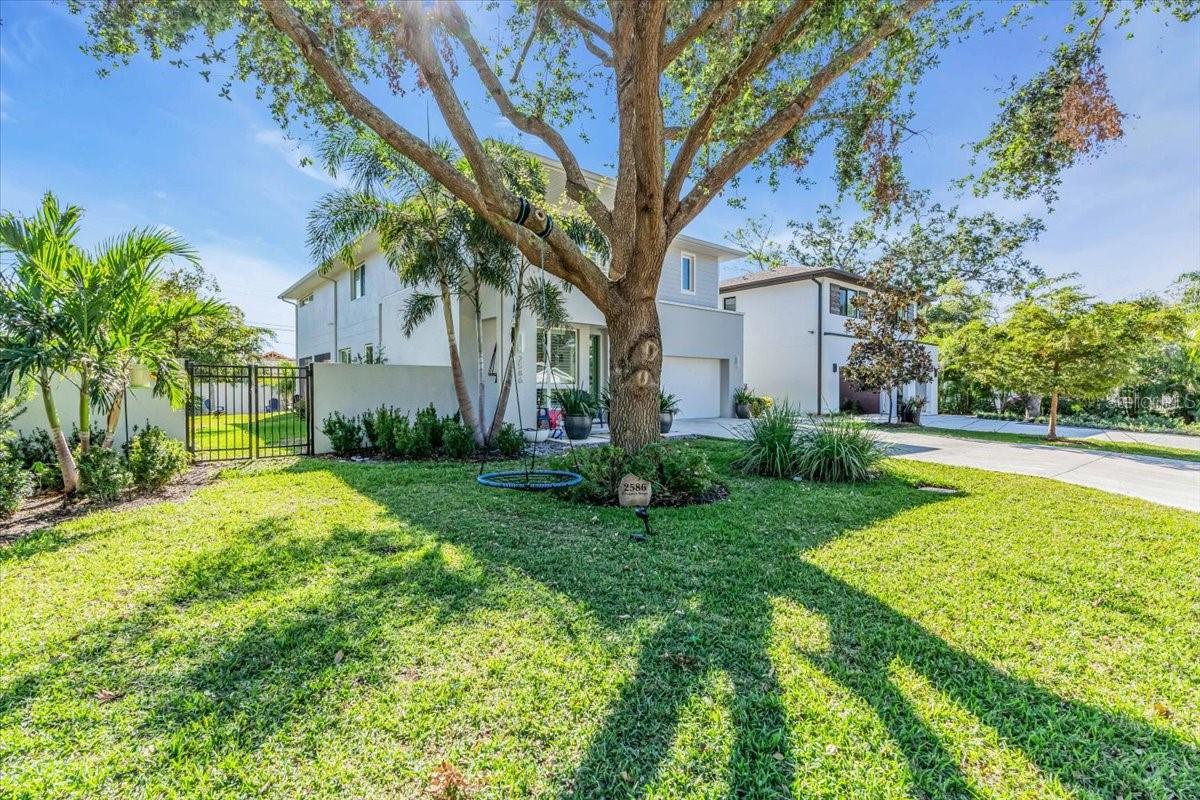 You won't find a home this spacious for a better price east of the trail! Located in the city of Sarasota's overlay district, zoned to allow for 7 night short-term rentals / exceptional income producing opportunities in the heart of town! Discover the perfect blend of contemporary design, thoughtful upgrades, and prime location in Sarasota’s sought-after Arlington Park neighborhood, “East of the Trail.” Designed and constructed by Oliver Caletti in 2020. This exquisite home offers over 3,500 square feet of living space, featuring three bedrooms, four bathrooms, multiple versatile bonus rooms, and plenty of space for a pool! The oversized 900+ square foot primary suite boasts a luxurious bedroom, spa-like bath, and two walk-in closets. Designed for culinary enthusiasts, the chef’s kitchen has been upgraded with GE Café appliances, quartz countertops, an induction cooktop, and a walk-in pantry. High-end finishes throughout the home include custom lighting in every room, Italian porcelain tiles, white oak floors, solid wood cabinetry, plantation shutters, and level 5 drywall coated with EuroLux Fine Paints throughout, enhancing its elegance and durability.
Additional upgrades include a privacy wall, A.O. Smith 80-gallon water heater, Toto toilets and Monte Carlo ceiling fans, ensuring comfort and convenience. The indoor-outdoor living experience is unmatched, with a large screened lanai featuring a Mont Alpi outdoor kitchen, a private walled backyard, and room to add a pool. Additional spaces include a den or optional 4th bedroom with a full bath and a bonus room perfect for an office, wine room, or secondary laundry setup, an upstairs loft. Built with exceptional quality, the home features solid block construction, hurricane impact windows and doors, a whole-house salt-free water softener, and is located in an elevated Zone X non-flood zone location.
Nestled on a corner lot, the property is just steps from the 20-acre Arlington Park, offering swimming pools, tennis courts, a basketball gym, a ½-mile walking trail, and a dog park. It’s also conveniently close to downtown Sarasota, Southside Village, and the area’s pristine beaches. This home is a masterpiece of modern craftsmanship, thoughtful upgrades, and refined finishes in one of Sarasota’s most desirable neighborhoods. Don’t miss your chance to call Arlington Park home!