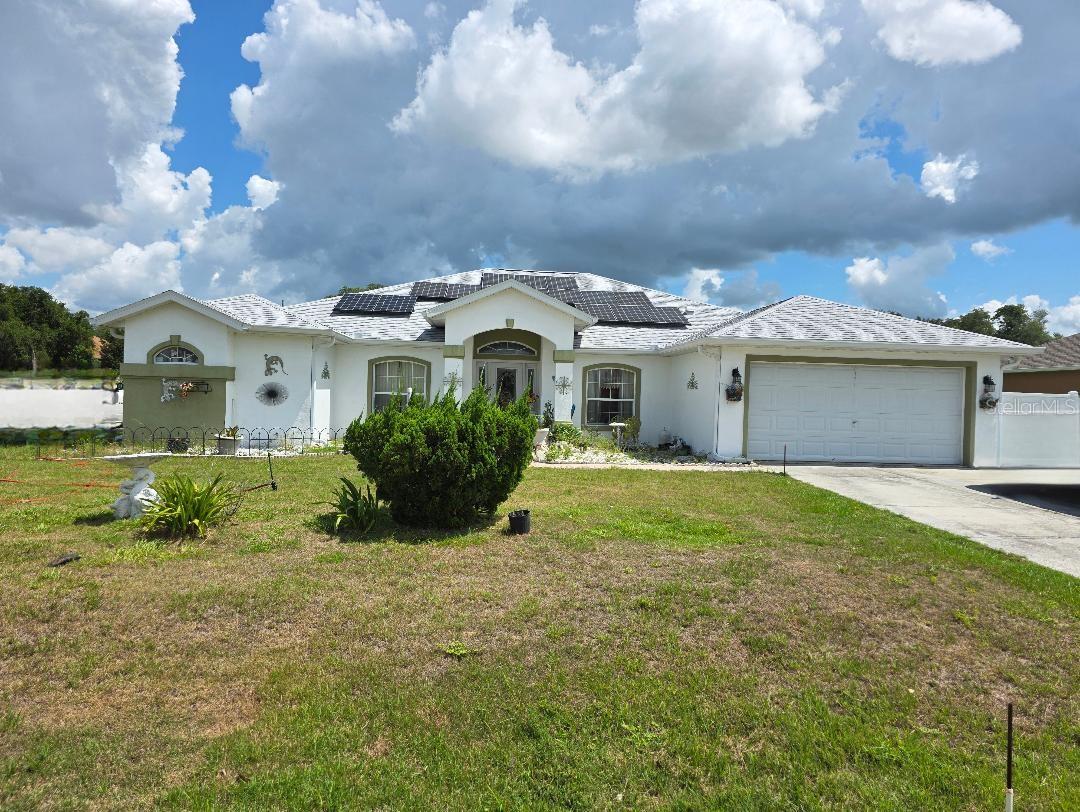 I am pleased to present to you this awesome 4-bedroom 2.5-bathroom home situated on a .46 acres lot on a very quiet cold-de sac Lane in the Ocala Waterway Estates. This home has an open floor plan with 2,436 sq ft. under air. New roof installed in January of 2023, Solar Panels installed May 2022 and a new A/C unit. A luxurious Master suite comprising 160 sq ft. of space, not including separate his & her closets and sinks. There is seamless flow between the dining room, living room and family room for ease and comfort. The kitchen is built with enough space for providing any type of cooking the family desire. All kitchen appliances are stainless steel. From the kitchen you enter an in-house laundry room which leads into a 2-car garage. Exiting from the rear of the house you will enter a covered lanai joining an enclosed 1/2 bathroom. You can now step into the open and fenced back yard to enjoy the refreshing outdoor ideal for family relaxation and entertainment. Seller will welcome all favorable offers for review.
