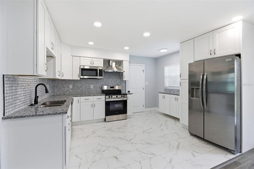 Photo of 4434 Cobia Drive, Tampa, FL 33617 (MLS # TB8463604)