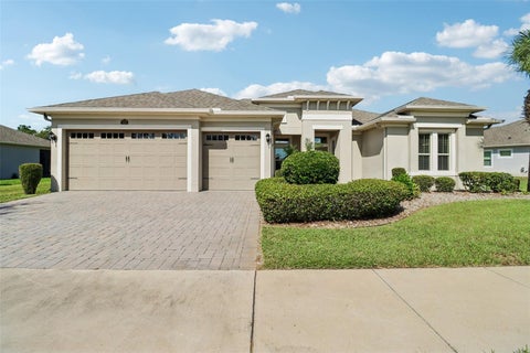 Photo of 121 Harvest Gate Boulevard, Groveland, FL 34736 (MLS # O6451381)