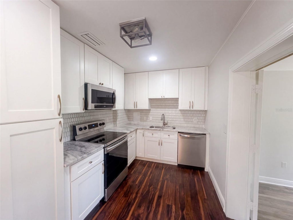 Photo of 10806 W Elbow Drive, Tampa, FL 33612 (MLS # O6442369)