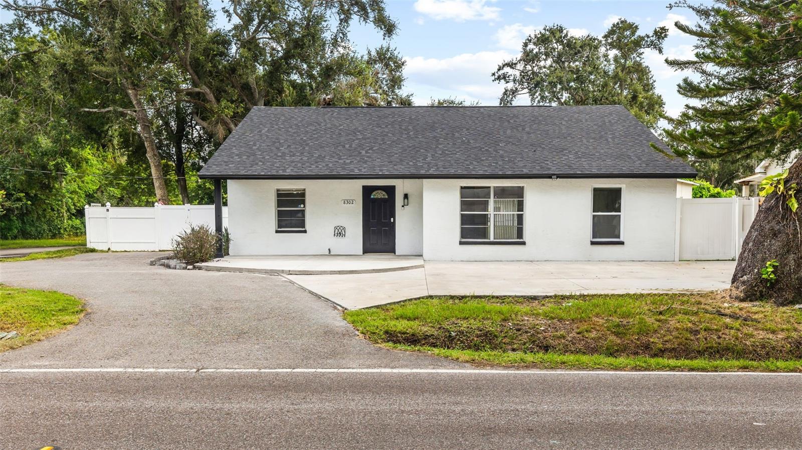 Welcome to 8302 Jackson Springs Rd – The Perfect Blend of Comfort, Style & Flexibility in the Heart of Tampa!
Fall in love with this beautifully updated 3-bedroom, 2-bathroom home offering over 1,773 sq ft of heated living space on a fully fenced 7,500 sq ft corner lot with ample parking and endless potential. Step inside the main home and enjoy modern vinyl flooring, a bright open-concept layout, an updated kitchen with contemporary finishes, and spacious bedrooms designed for comfort. Enjoy the convenience of your own laundry closet with washer and dryer included, and relax knowing this home is move-in ready from day one. What truly sets this property apart is the private-entry mother-in-law suite—a rare find! Whether you're housing extended family, creating a guest retreat, or seeking rental income, this fully self-contained suite includes its own living space, kitchen, full bathroom, separate backyard, and dedicated parking area for complete privacy and independence. Outside, the corner lot offers more yard space, secure fencing for pets or ckids, and plenty of room for entertaining. Located in a quiet, no-HOA neighborhood, you’re just minutes from Tampa International Airport, downtown, major highways, top-rated dining, shopping, and Florida’s beautiful Gulf beaches. This home has it all—versatile living space, modern updates, and income-producing potential—all in a prime location. Don’t miss your chance to own this incredible property. Schedule your private showing today and make it yours!