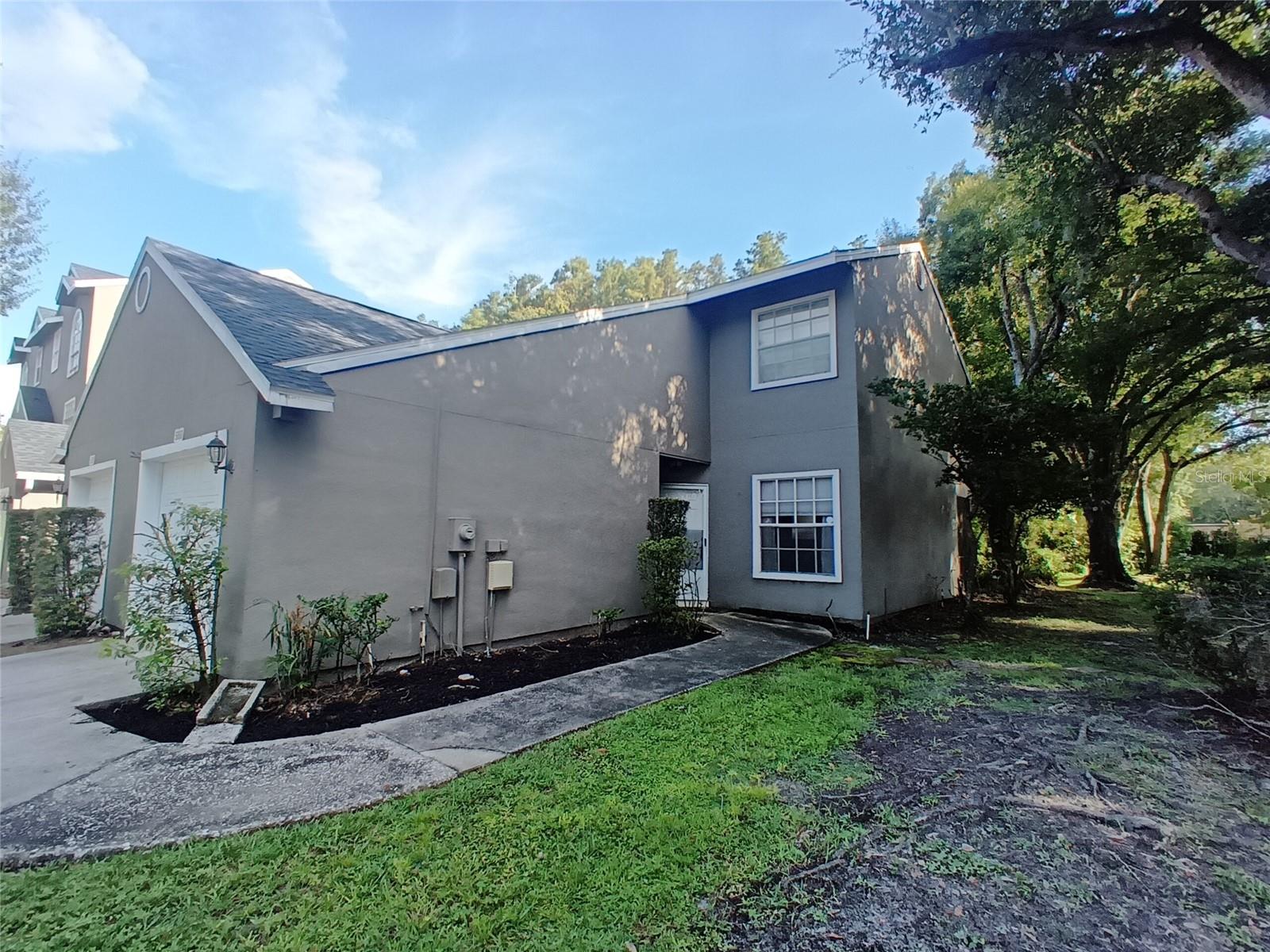 Beautiful "turnkey" 2 bedroom, 2.5 bath Townhome with attached garage !!!! Prime location in Carrollwood/Citrus Park close to everything in Tampa. Easy access to Vets Expressway, Mall, Airport, Beaches and Orlando. Built in 1985 but updated style like new construction. New roof and skylight installed Nov 2024. Upgrades include renovated half bath downstairs, kitchen, 2nd bathroom and water heater. Corner unit with additional parking across, step inside to living room/dining room combo with laminate flooring, screen patio overlooking conservation area, skylight over staircase, Upstairs you have split bedrooms with full renovated bath and master bedroom with walk in closet. Your HOA fees covers everything outside of your home, including the roof and community pool. Don't miss your opportunity to have the American Dream.