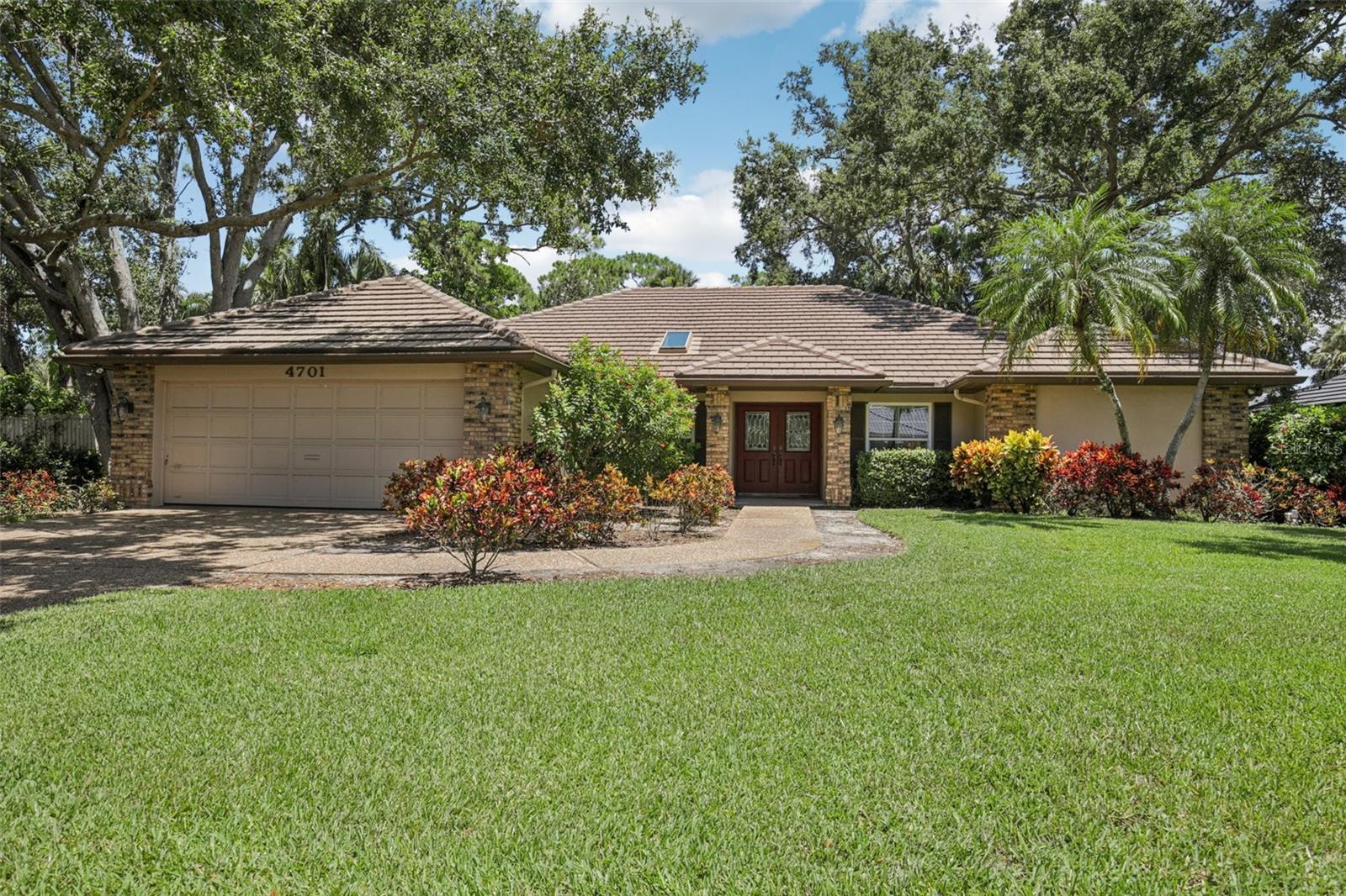 Best value, nestled in the heart of Sarasota, this beautifully maintained one-story home is situated in the sought-after, gated community of The Landings. Lovingly cared for by its original owners, this residence boasts a well-thought-out floor plan that blends comfort and functionality. The spacious primary suite is complemented by an adjoining den that can be used as an additional living space or office, offering the perfect retreat for work or relaxation. The living room, featuring elegant French doors, opens to a charming enclosed Florida room. Guests will feel at home in the two private guest suites, ensuring comfort and privacy. The kitchen opens to a cozy family room with vaulted ceilings and a wood-burning fireplace, creating a warm and inviting gathering space. Just outside, a private and peaceful paver patio offers the perfect spot for outdoor relaxation. Recent updates enhance the home's appeal, including luxury vinyl oak flooring, newer windows, a replaced irrigation system, and an updated A/C. Beyond the home, The Landings offers an exceptionally dog-friendly neighborhood, scenic nature trails, a fishing pier, and a kayak launch perfect for those who love the outdoors. Ideally located just moments from Sarasota's renowned dining, shopping, and cultural attractions, this home presents a rare opportunity to enjoy the best of Sarasota living.