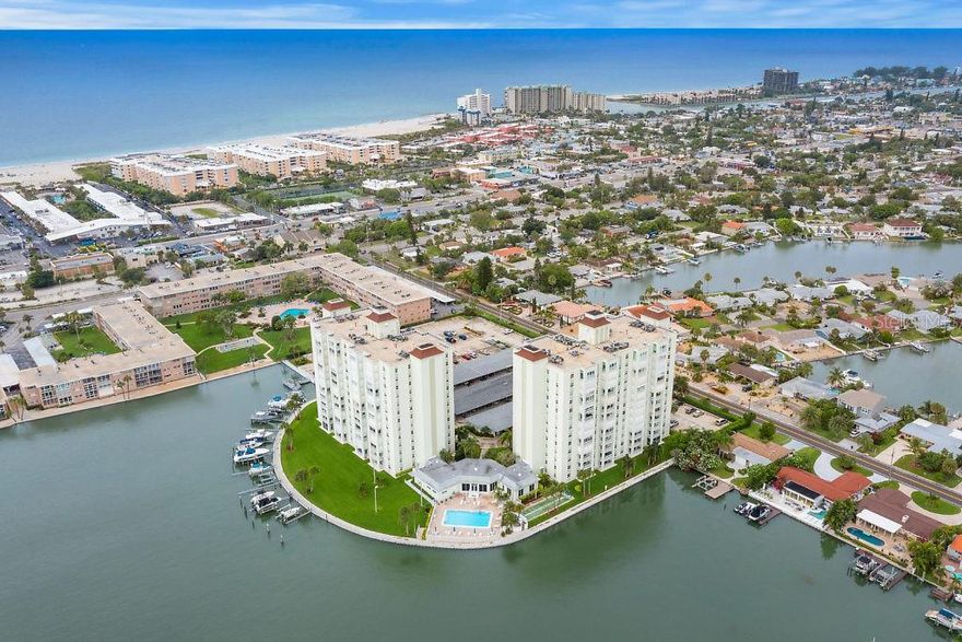 Welcome to Three Palms Pointe, where the beach is literally around the corner and every day feels like vacation. Located on iconic St. Pete Beach, you’re just moments from the Gulf of Mexico plus tons of great local restaurants, shops, live music + waterfront hangouts. This 1-bed and a 2-bath condo (843 sq ft) delivers wide WESTERN exposure from the 6th floor. The great room opens to your private water view balcony through sliding glass doors, and yes you even have hurricane shutters. The kitchen has been updated with granite counters and cabinets- Light and bright. Primary Suite is generously sized with a vanity area, oversized walk-in closet and ensuite bath with tub/shower. For added convenience, there is a second half bath. Laundry is located on the same floor. Parking + an additional storage unit are assigned with unit 601. Three Palms Pointe community provides residents with a guard-gated entry, heated pool, club room, billiards, fitness center, shuffleboard, bicycle and kayak storage (additional fee), fishing pier, and boat slips rentals available by reservation. Love the beach lifestyle? Then this is where you want to be. Schedule your private showing today — sunsets included.