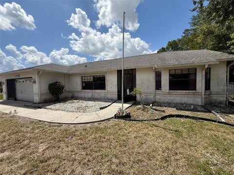 Photo of 8548 Cypress Lakes Boulevard, New Port Richey, FL 34653 (MLS # L4963354)
