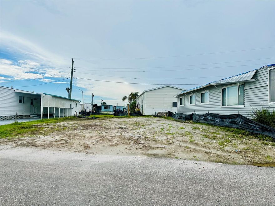 Bring your vision to life in Tropic Isles Co-Op & Marina, a resident-owned 55+ waterfront community; one of the West Coast’s best-kept secrets!  This 50’ x 70’ vacant lot offers the perfect opportunity to design your Florida retreat just the way you want it. Facing North for ideal light and breezes.  Tropic Isles features resort-style amenities including a full-service marina and boat ramp, clubhouse, heated pool and spa, fitness center, shuffleboard, kayak launch, and a calendar full of social activities. Just minutes from downtown Palmetto, Bradenton, and Anna Maria Island beaches, you’ll enjoy both convenience and coastal charm.