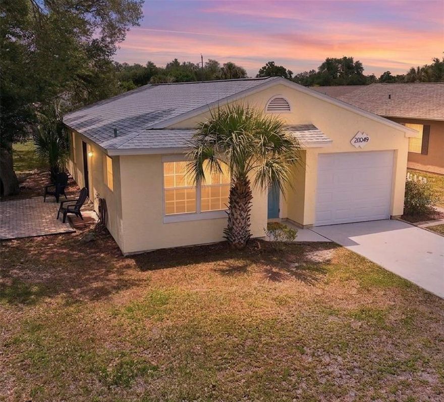 Welcome to this inviting Port Charlotte home set in a quiet, well established neighborhood with a community pool, convenient access to shopping, dining, parks, and Gulf Coast beaches. The property features a comfortable, functional layout with a bright main living area and a modern electric fireplace, sliders leading out to the lovely brick paver patio, ideal for everyday living or casual entertaining. Kitchen has granite countertops and stainless appliances.  The bedrooms are well sized and offer flexibility for guests, a home office, or hobbies.  New roof 2023, new air conditioner 2025, and newer hot water heater 2022.  Newer tile throughout.  Exterior freshly painted.  The community has underground power lines, public water & sewer.  8’ x 8’ shed.  In addition to the Olympic-size heated pool, enjoy the private clubhouse, fitness center, billiard room, shuffleboard, all in a park-like setting.  NOT IN A FLOOD ZONE. Located in a Deed Restricted Community, close to shopping, and restaurants.  With its central location and practical design, this property presents a solid opportunity for buyers seeking value and a relaxed Florida lifestyle.