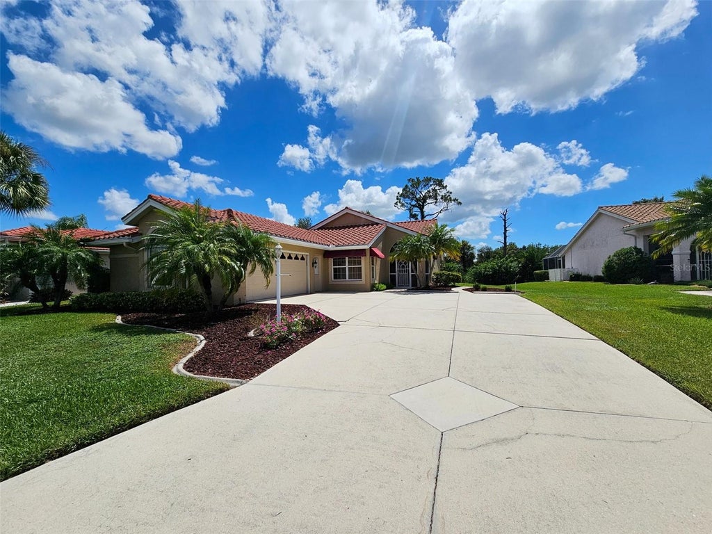 Photo of 8351 Creekview Ln, Englewood, FL 34224 (MLS # A4705646)