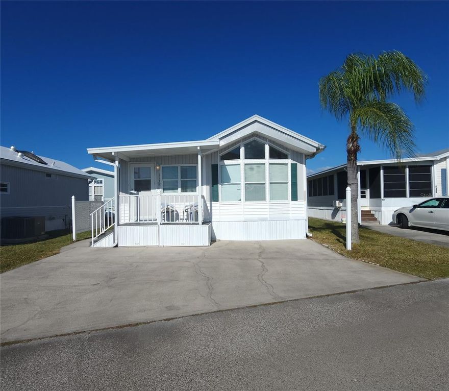 CHEERFUL HOME IN ACTIVE 55+ COMMUNITY! This one bed, 1 1/2 bath home is move-in ready! This furnished home features a spacious dining area, inside laundry area with extra storage, and a charming, rear enclosed porch that is currently used for extra sleeping options. The full bathroom has a tub/shower and linen closet. All appliances included, metal roof, central A/C. SUGAR CREEK COUNTRY CLUB has LOW HOA FEES OF $600 each QUARTER which include internet, cable, grass mowing, water, sewer and trash. There are 2 swimming pools, heated spa, clubhouse, tennis, pickleball, shuffleboard, a fitness room, and workshop. There is an active social calendar during the winter months. Enjoy this community's proximity to the River Links Golf Course and the Braden River. Sorry this is not a dog lot.